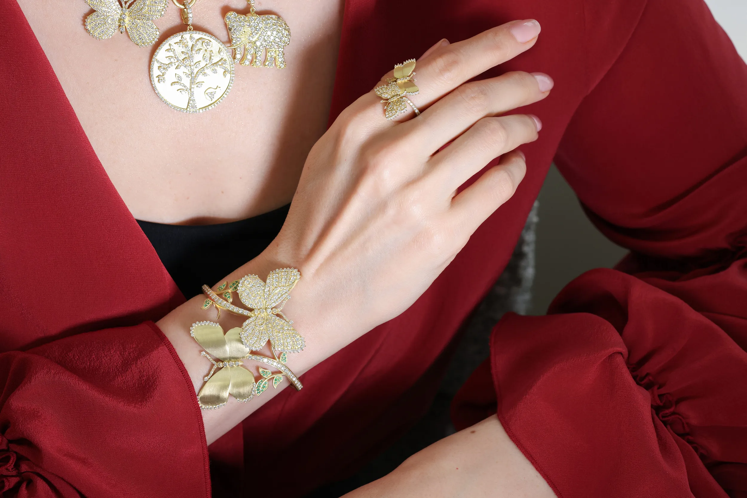<p>Katerina Perez wears the Tanya Farah Kissing Butterflies diamond cuff and matching ring, both with diamonds in 18k yellow gold</p>
