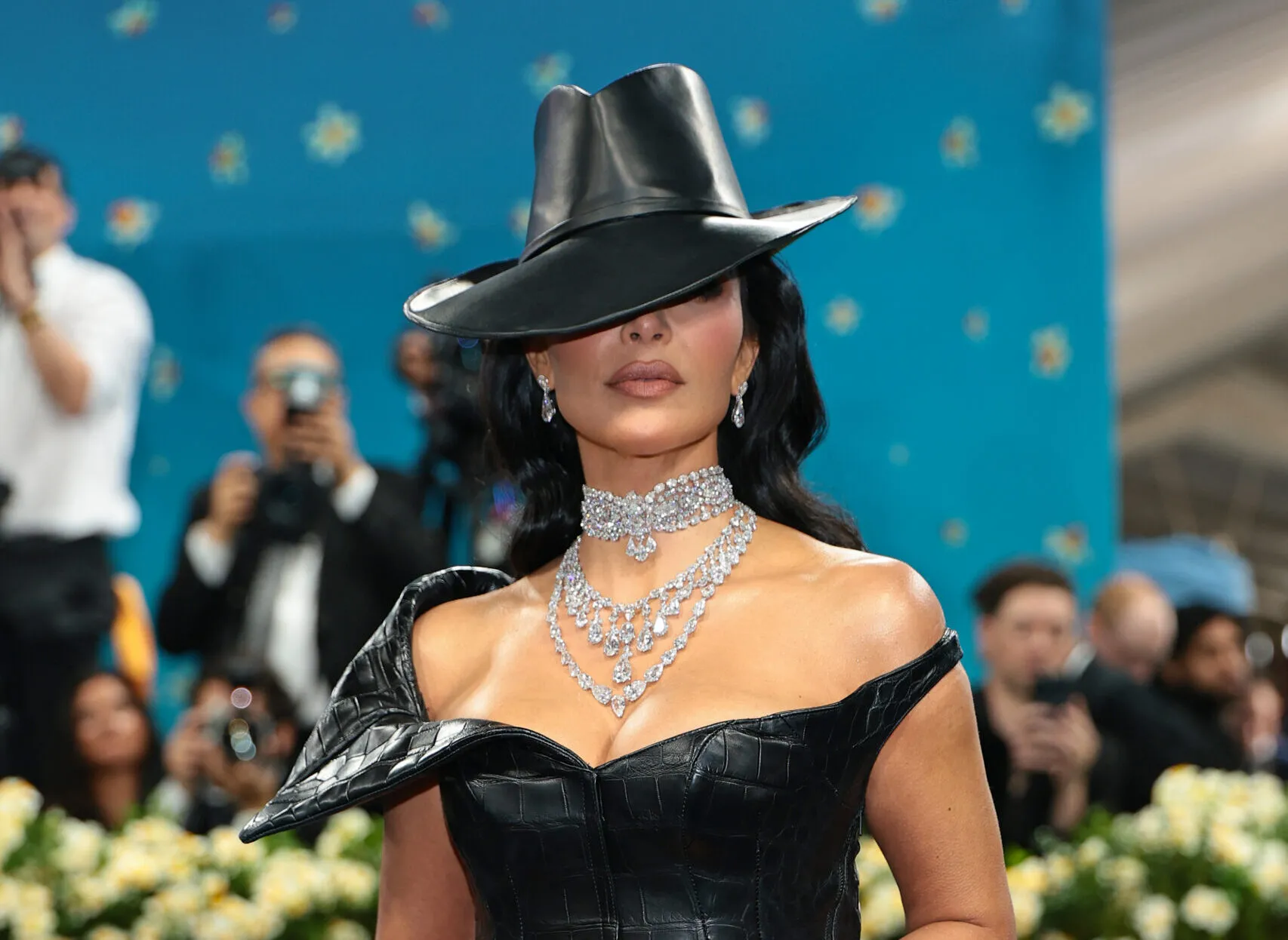 Kim Kardashian piled on the diamonds: a choker, fringe necklace and aline necklace with matching diamond earrings and ring by Moussaieff