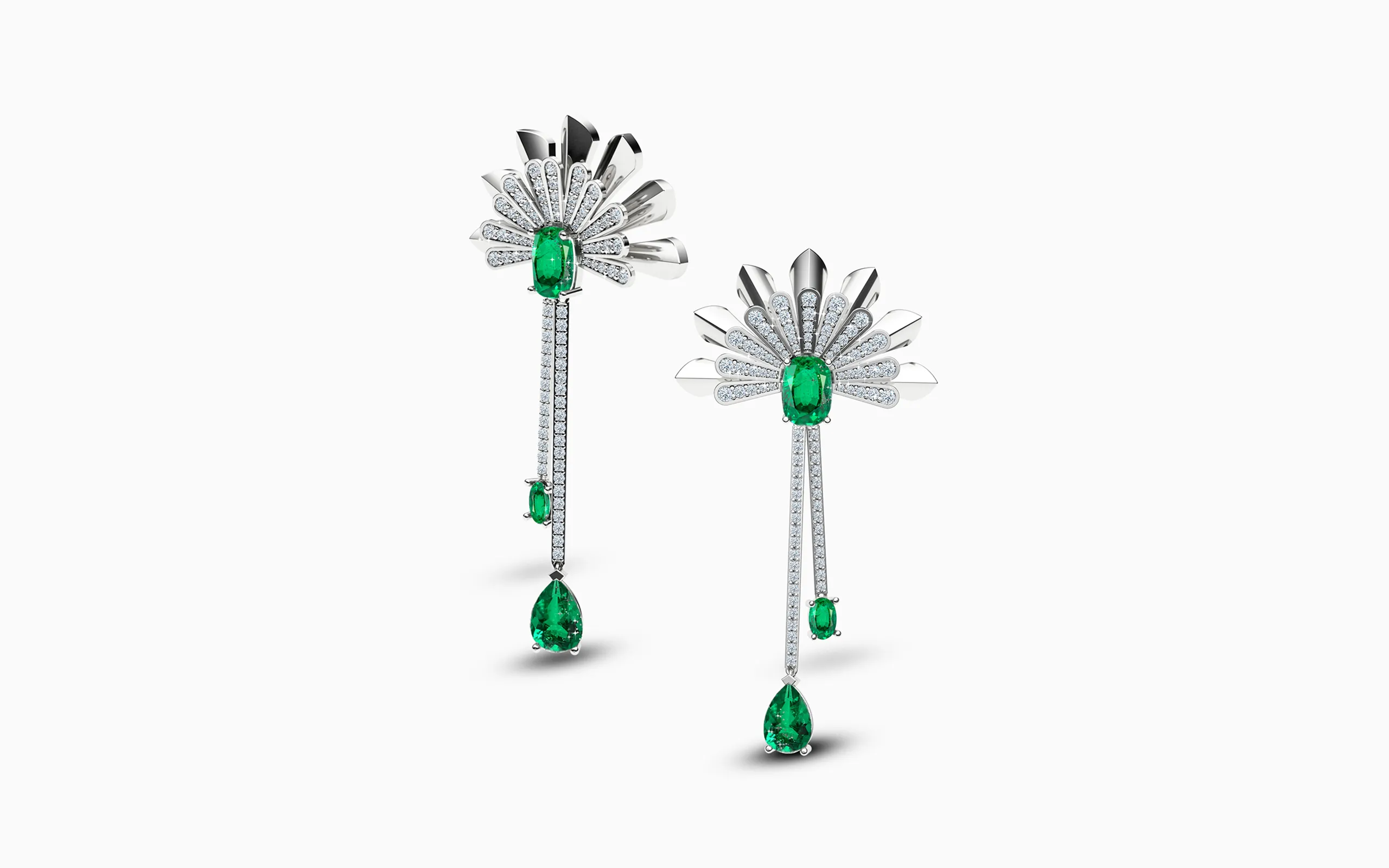 A pair of Art Deco-inspired earrings by Korbička Šperky with pear and oval-shaped emeralds and diamonds, set in 18k white gold 