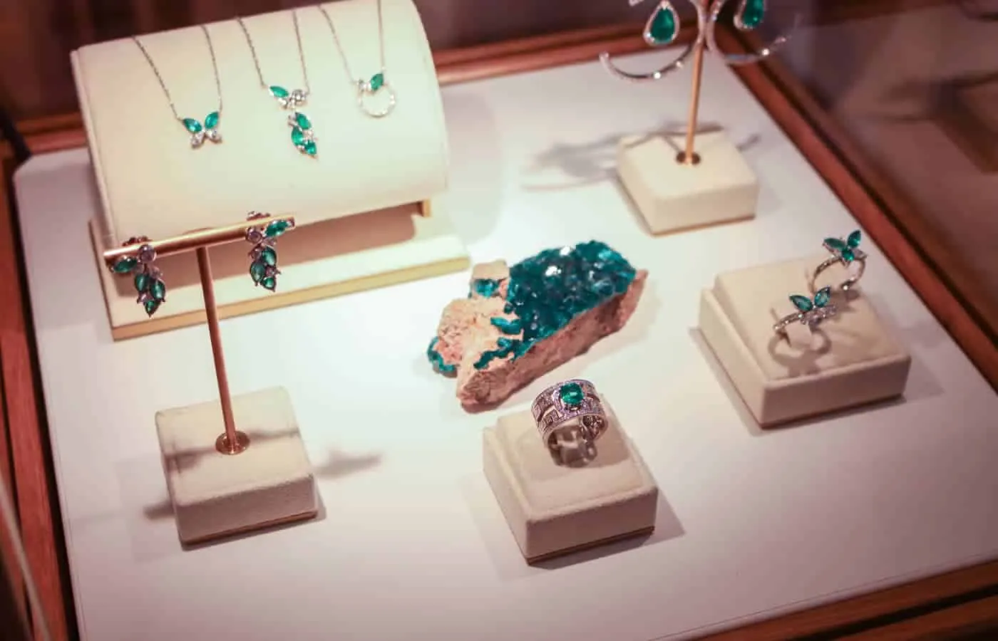 Fine jewellery pieces set with emeralds on display at Korbička Šperky
