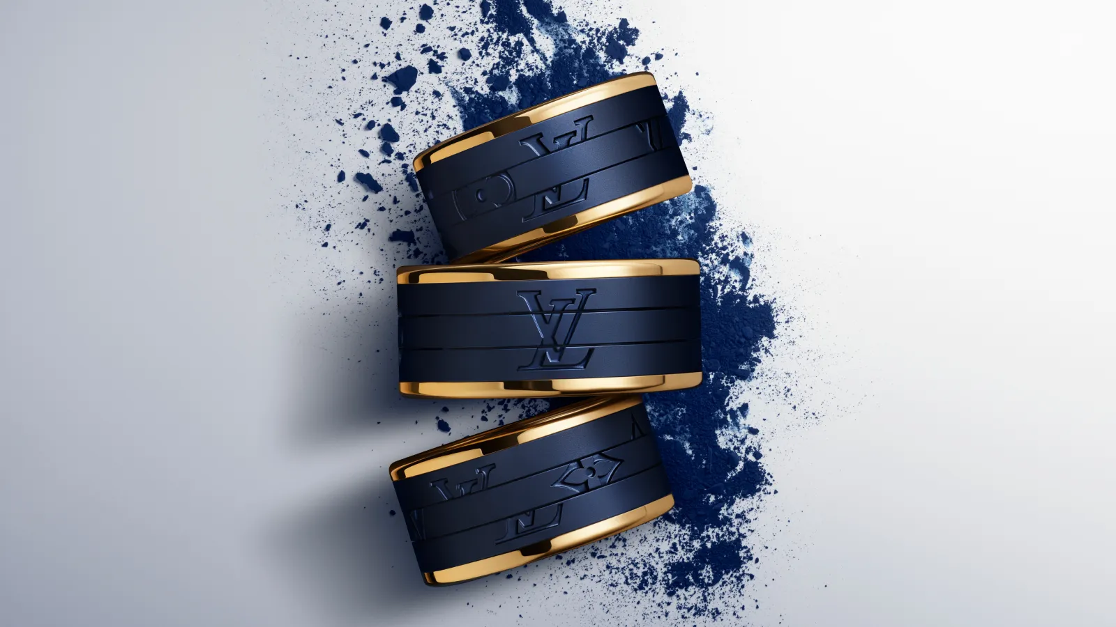 A trio of Les Gastons Vuitton men's rings by Louis Vuitton in blue titanium and 18ct yellow gold