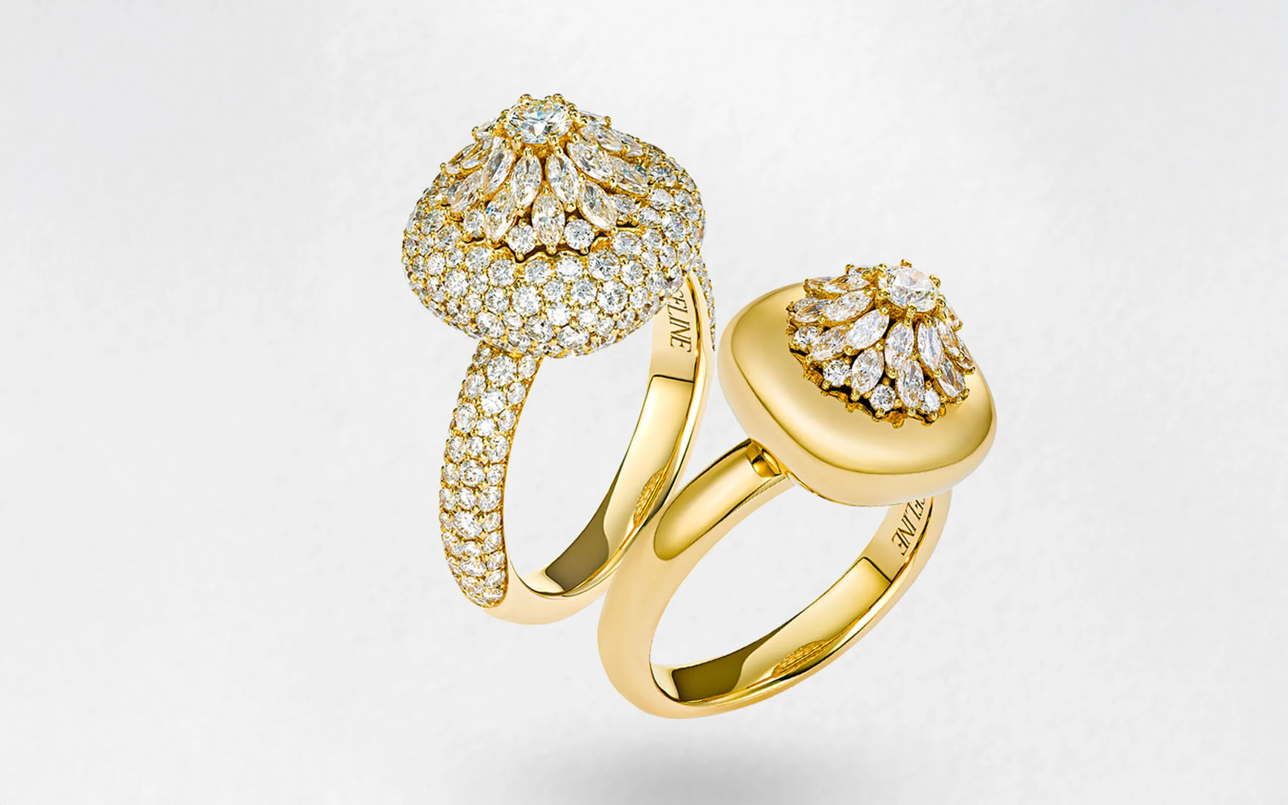 Marceline Paris Daisy Cushion ring (left) with 2.92 carats of diamonds and the Daisy ring with 0.72 carats of diamonds, both in 18k yellow gold from the Flower of Life collection 