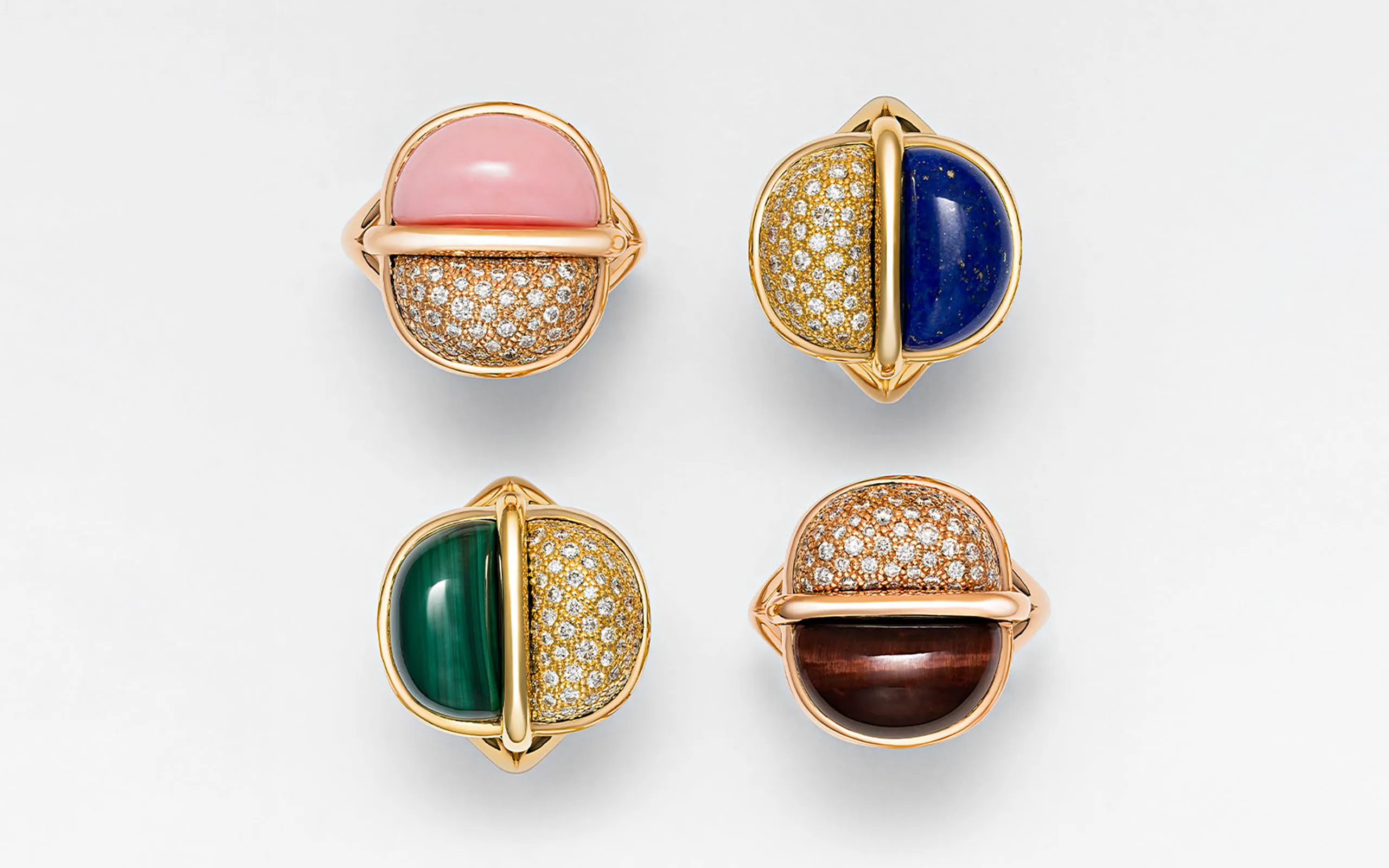 A selection of cocktail rings with coloured gemstone cabochons and white diamonds set in 18k yellow gold by Marceline Paris 