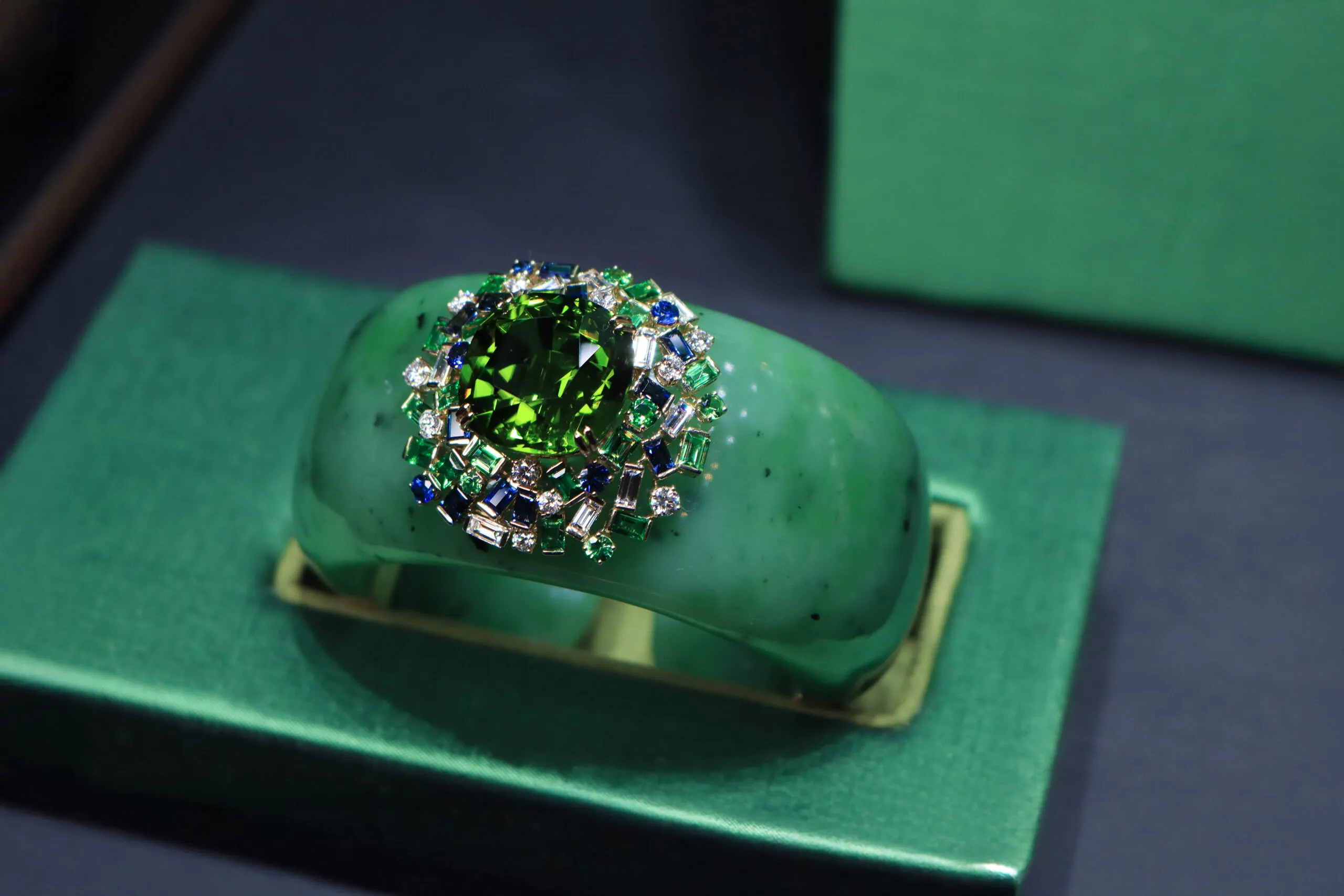 Margot McKinney Coral Cay cuff with a 40.82 carat peridot, 1,096.65 carats of nephrite, diamonds, tsavorites, and blue sapphires set in 18k yellow gold