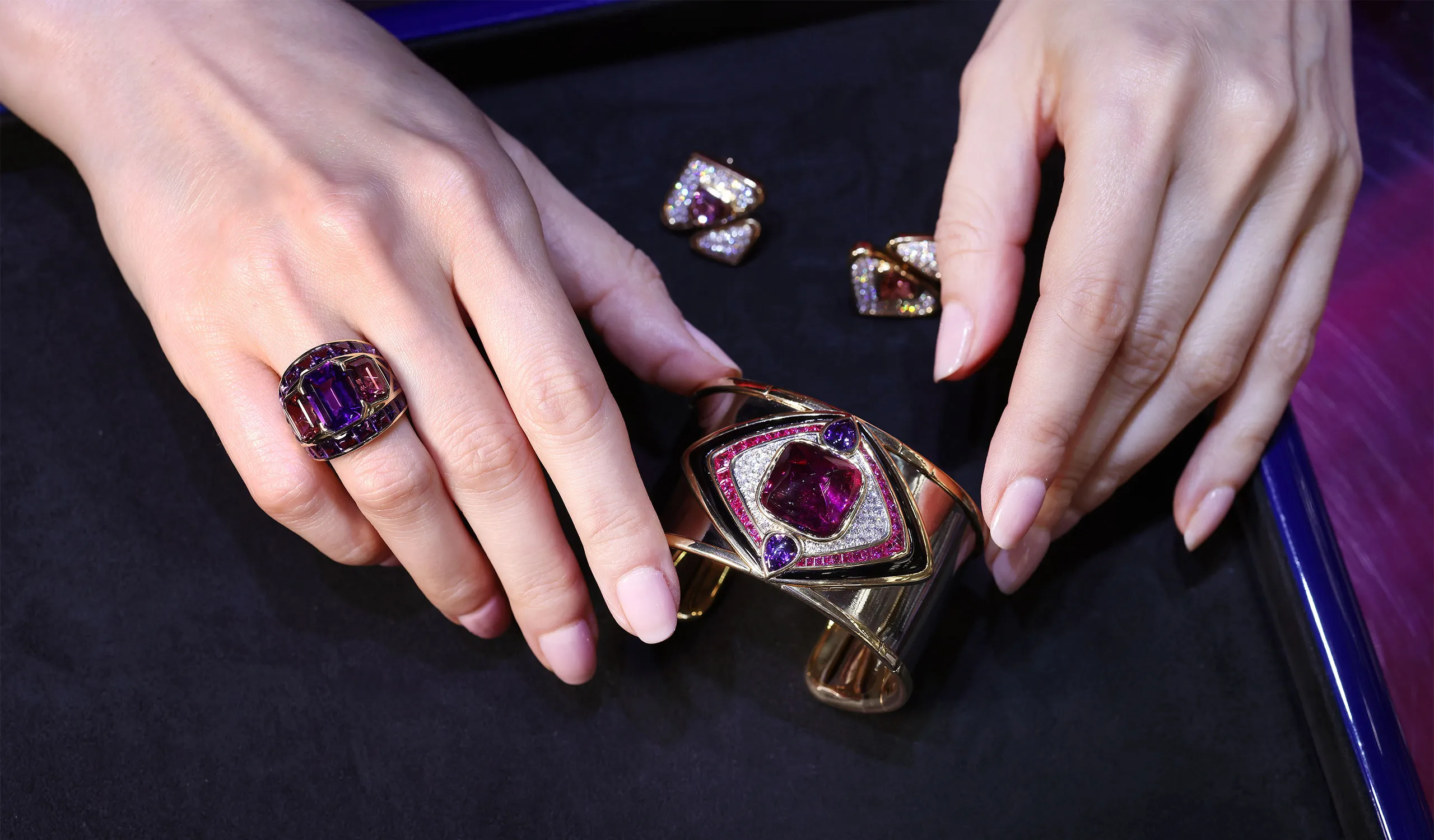 <p>The Azia ring is set with a 4.14ct emerald cut amethsyt, 4.02ct emerald cut pink tourmalines and 4.14ct buff-top pink amethysts in 18k yellow gold</p>