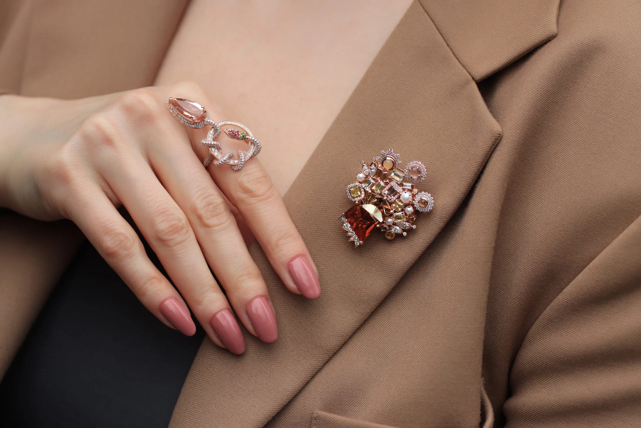 Katerina Perez wears the Mariyeh Ghelichkhani Tree of Life brooch with a 13-carat tourmaline, pastel-coloured sapphires, diamonds and pearls, alongside the Serpent’s Embrace ring with a pear-shaped morganite and diamonds, both in 18k rose gold 