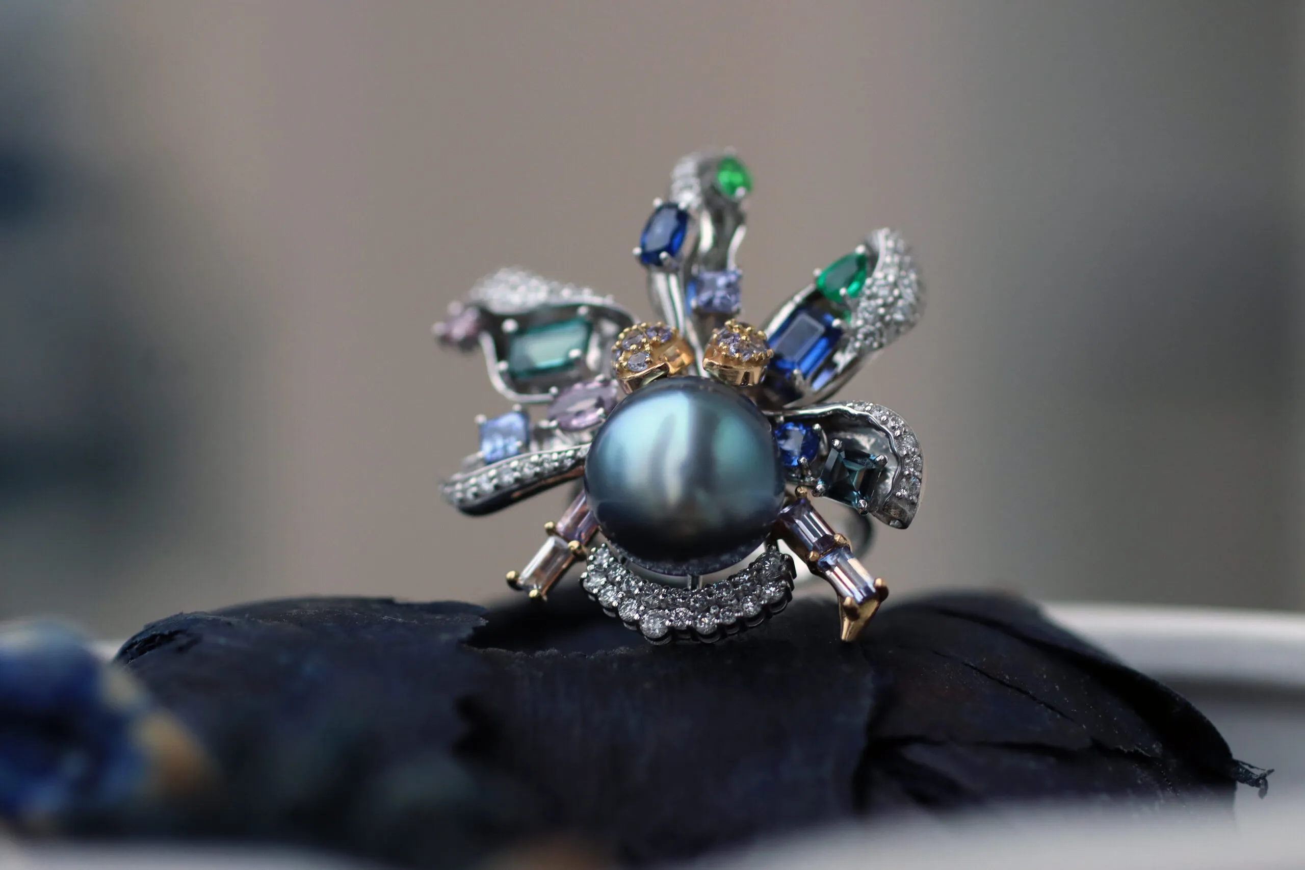 Mariyeh Ghelichkhani Aqua ring from The Orchid collection with a Tahitian pearl, tourmalines, emeralds, sapphires, tanzanites and diamonds, set in 18k white gold to resemble the petals of a flower