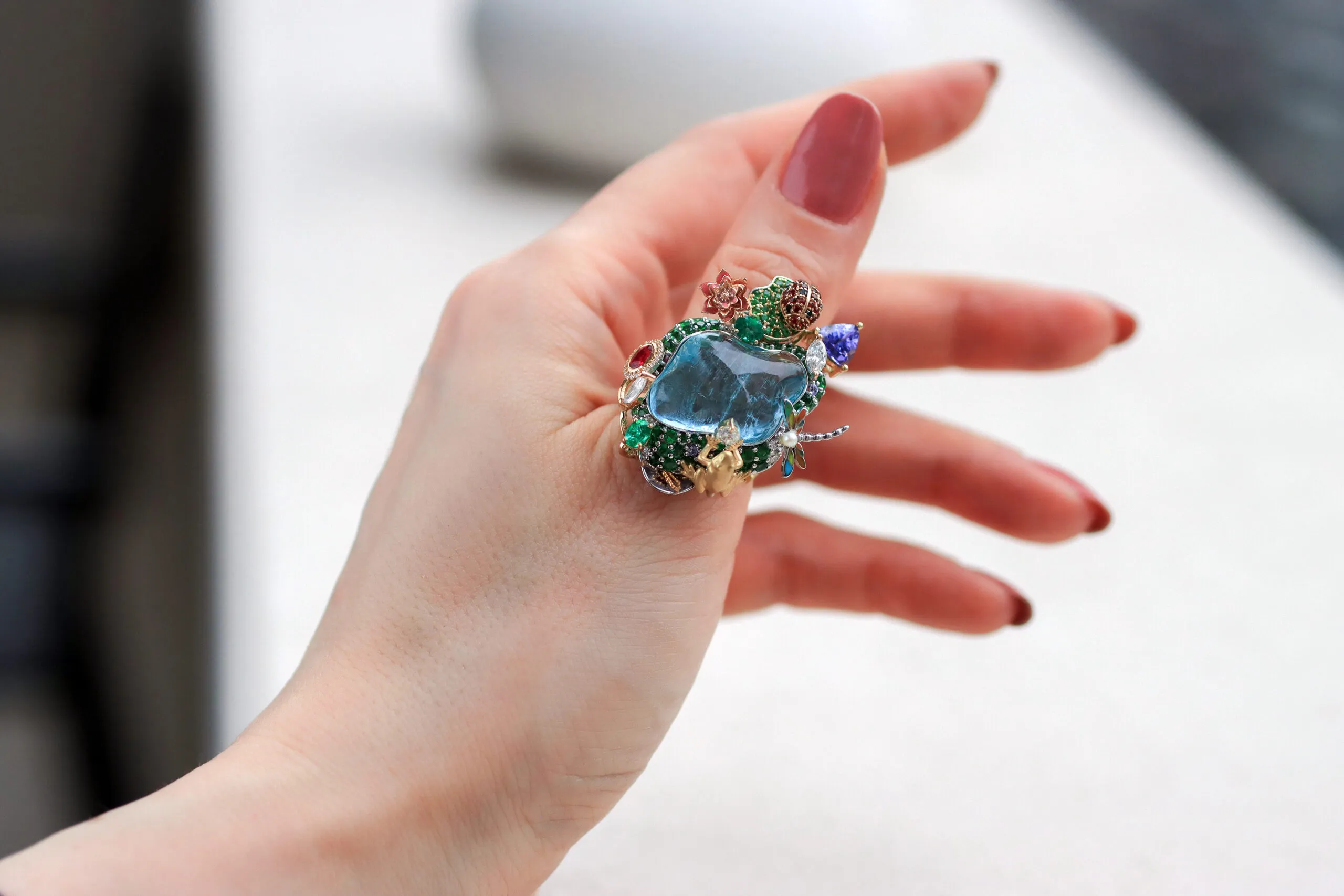 Mariyeh Ghelichkhani’s Hayat ring with a 22-carat aquamarine surrounded by a gem-set water lily, lotus flower, frog, dragonfly and ladybug is inspired by a cherished pond at her family’s holiday home