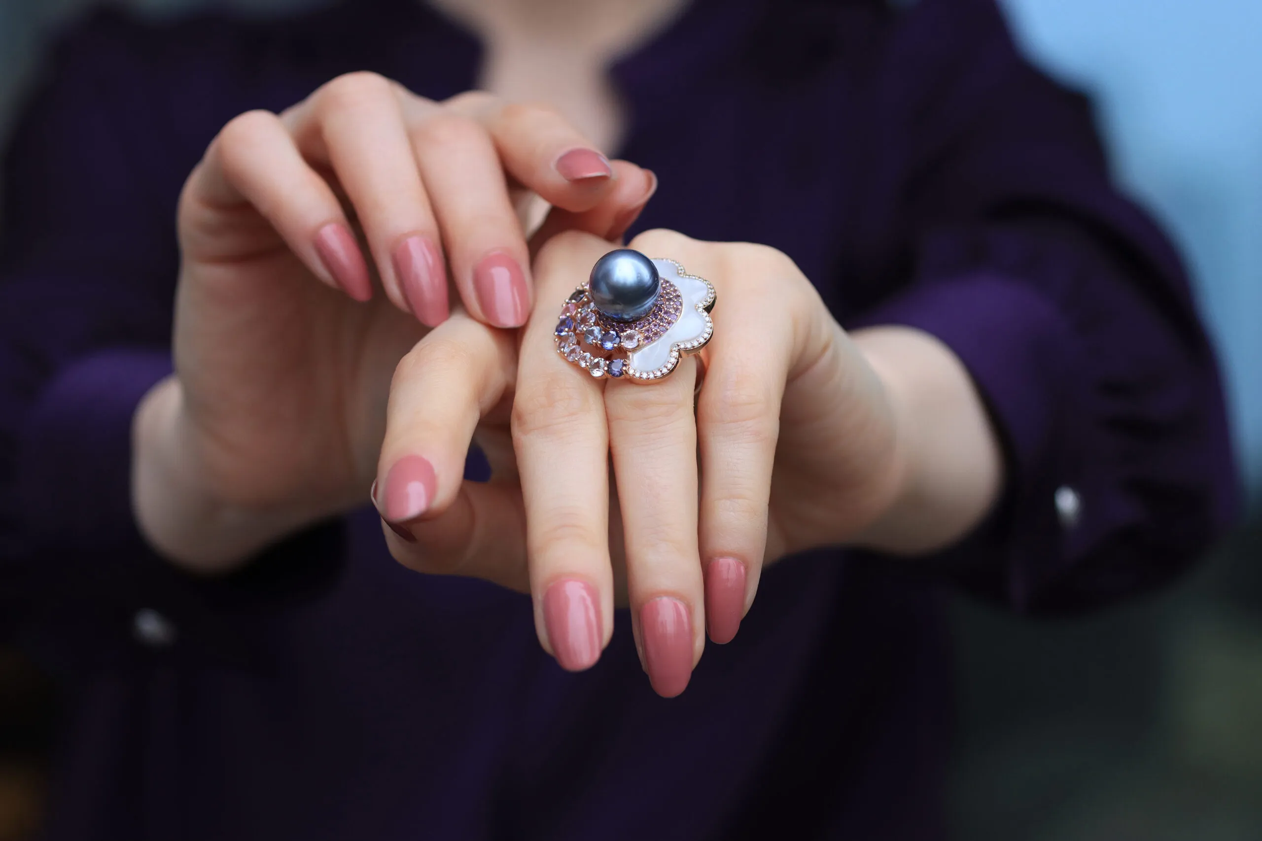 A closer look at the Passing Cloud ring by Mariyeh Ghelichkhani with a Tahitian pearl, mother of pearl, diamonds and pastel-coloured sapphires set in 18k yellow gold 