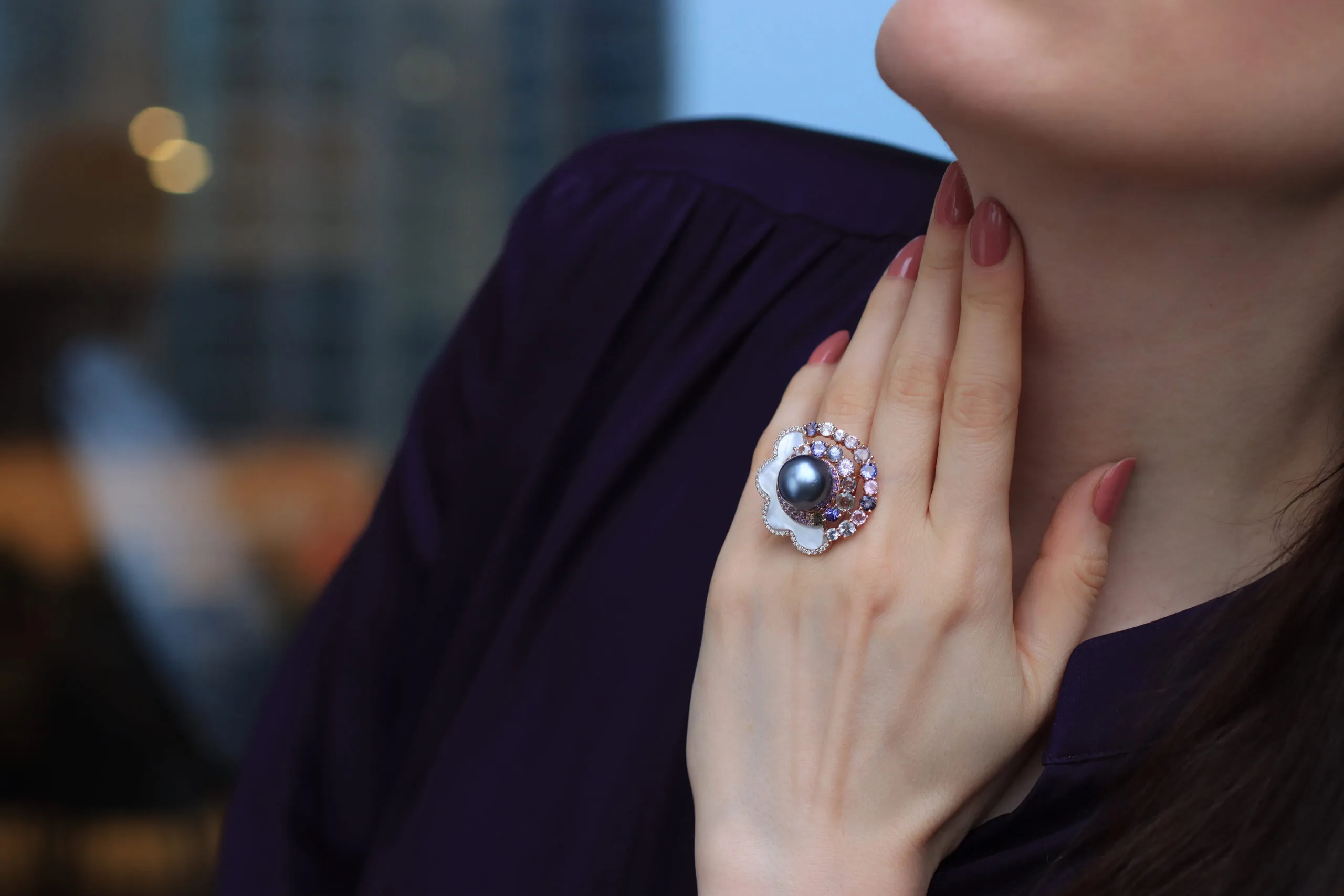 Katerina Perez wears the Mariyeh Ghelichkhani Passing Cloud ring with a Tahitian pearl, mother of pearl, diamonds and pastel-coloured sapphires set in 18k yellow gold 