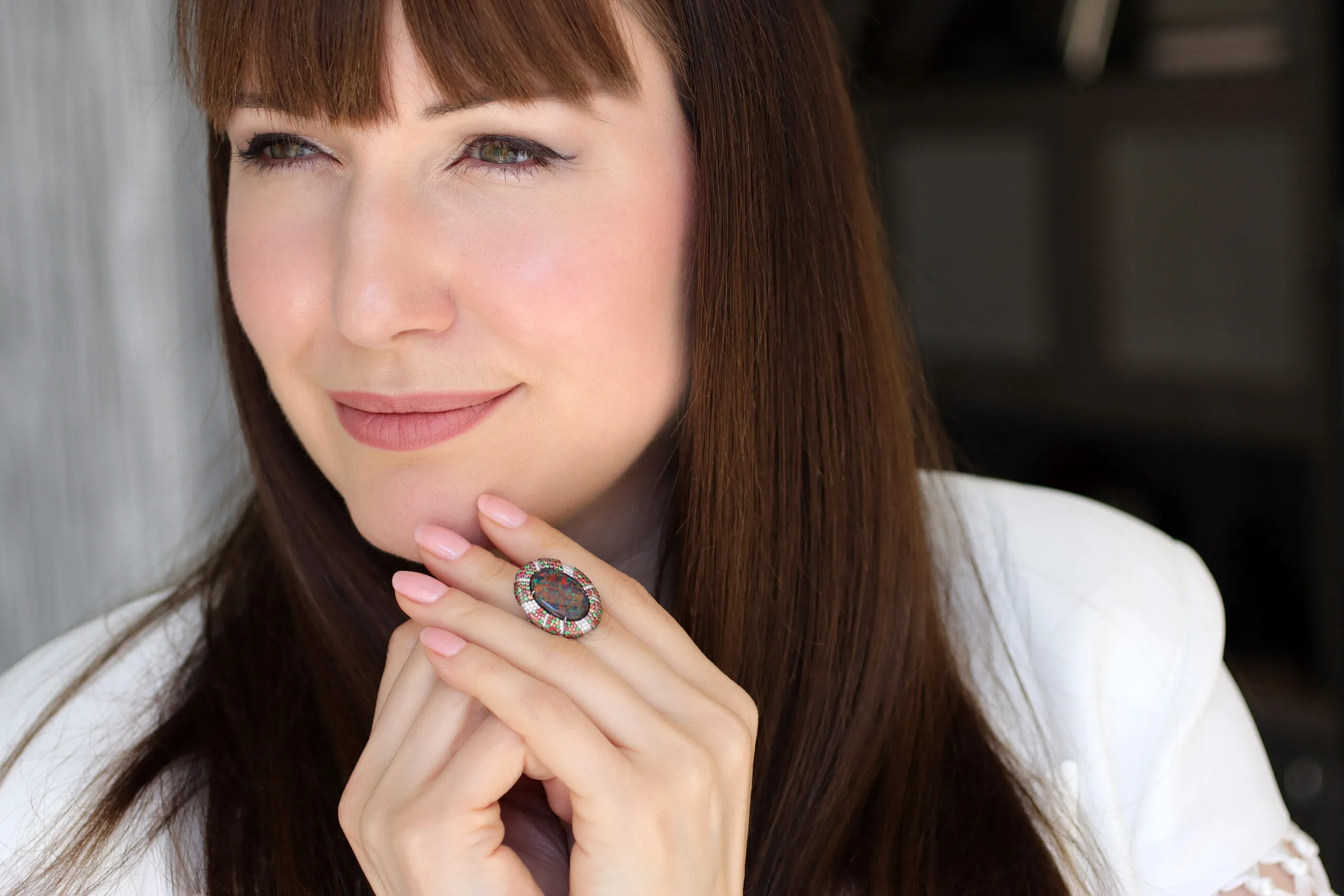 Katerina Perez wears a right-hand ring by Martin Katz, set with a 6.80-carat oval-shaped Australian black opal, diamonds, sapphires and tsavorites in platinum