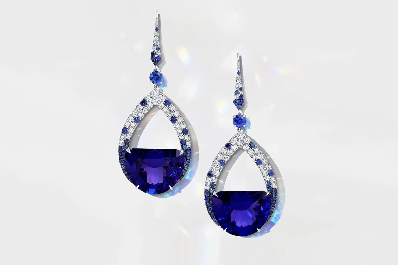 Martin Katz Half Moon tanzanite earrings with specially-cut half moon tanzanites accented with round diamonds and sapphires in 18k white gold ©martinkatzjewels