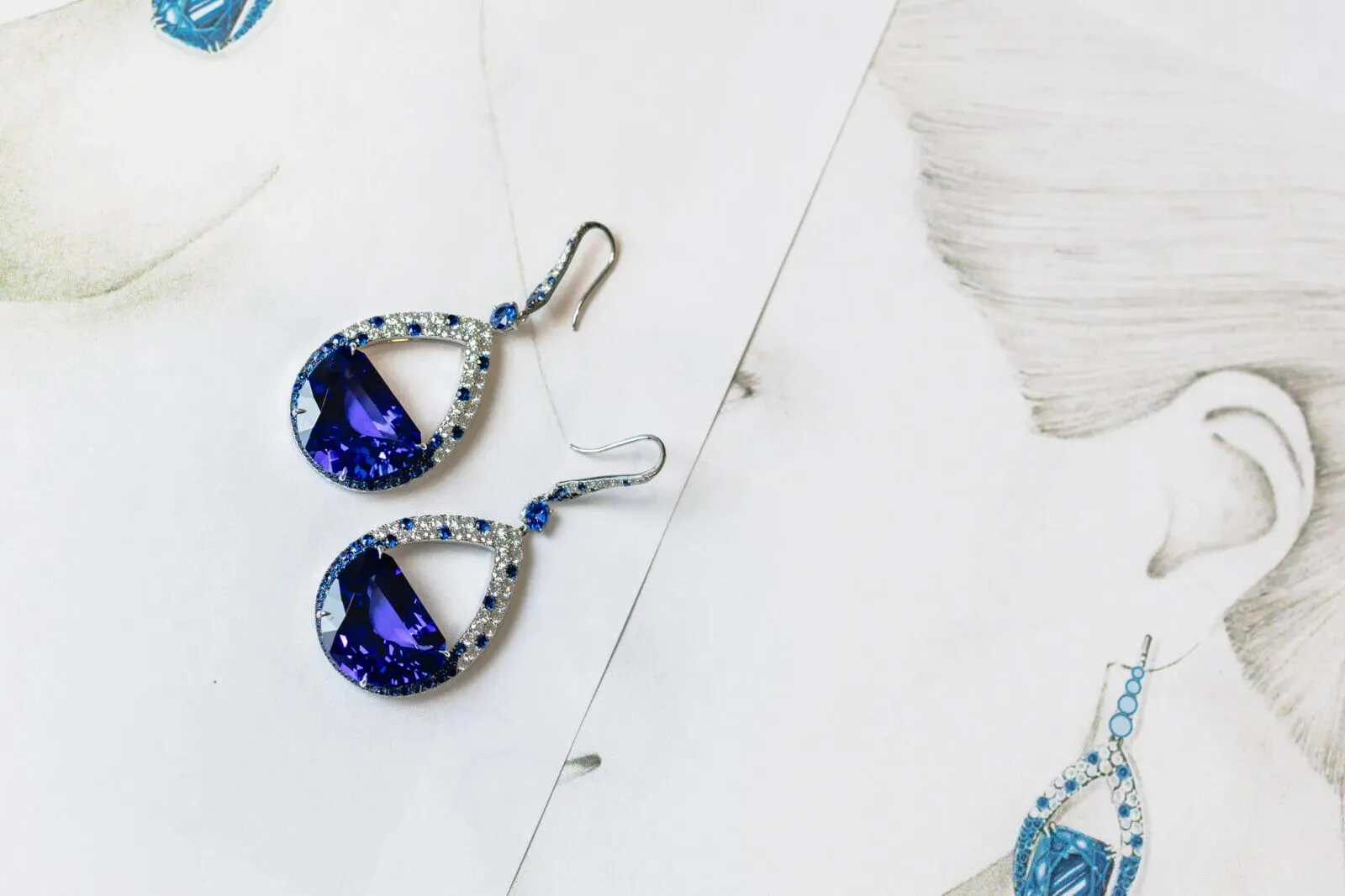 Martin Katz Half Moon tanzanite earrings with specially-cut half moon tanzanites accented with round diamonds and sapphires in 18k white gold ©martinkatzjewels