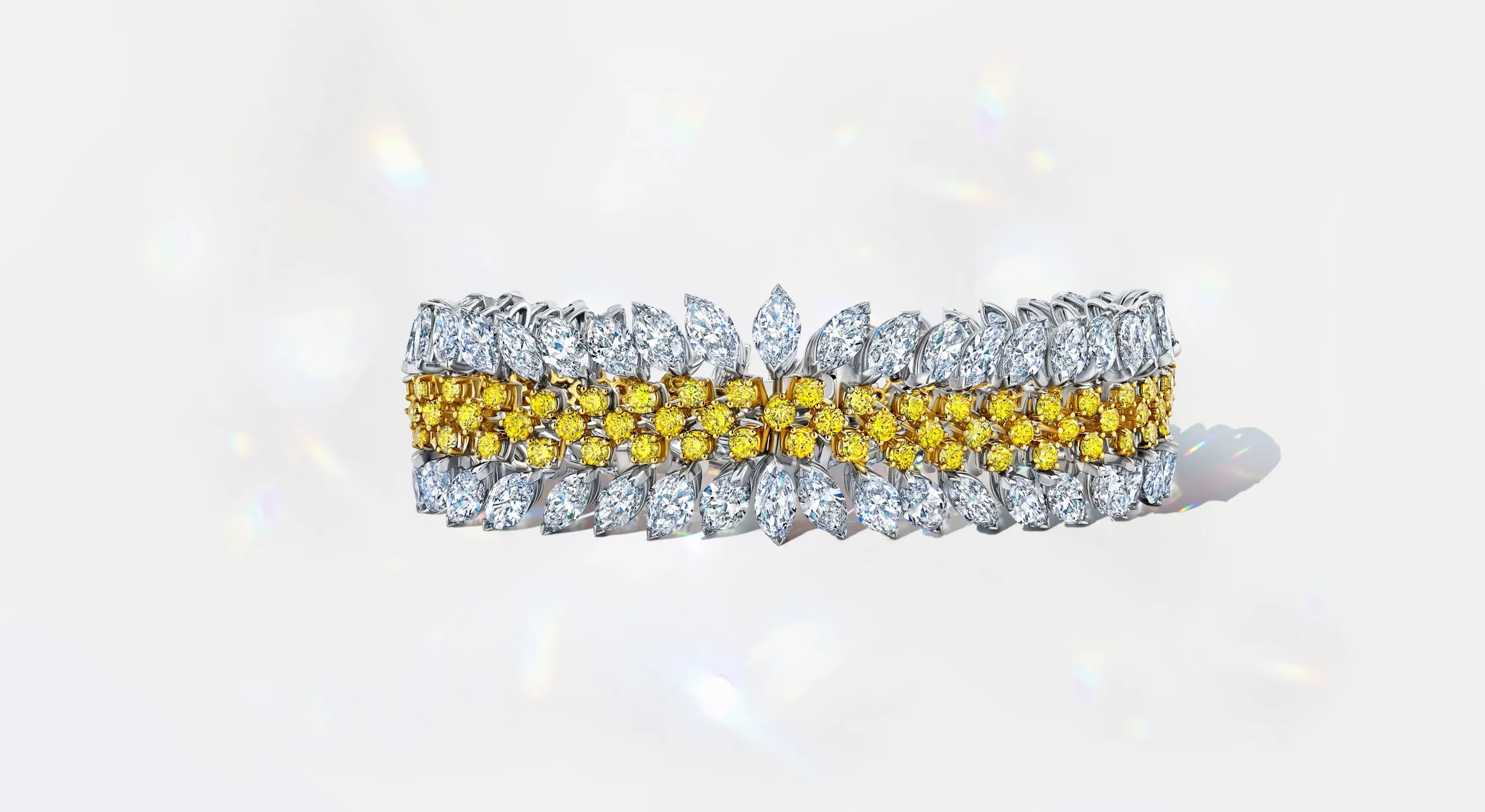 Martin Katz fancy vivid yellow and white diamond bracelet, set with 122 round diamonds and 81 marquise diamonds in 18k yellow and white gold ©martinkatzjewels