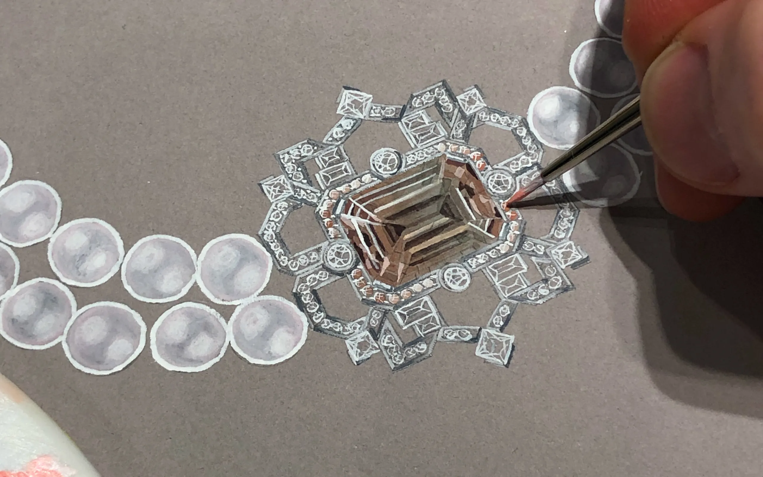 Designing the Art Deco-inspired transformable brooch-pendant by Matthew Ely, set with a 24.34 carat bi-colour tourmaline in shades of pink, surrounded by colour fade sapphires and diamonds in 18k white gold 