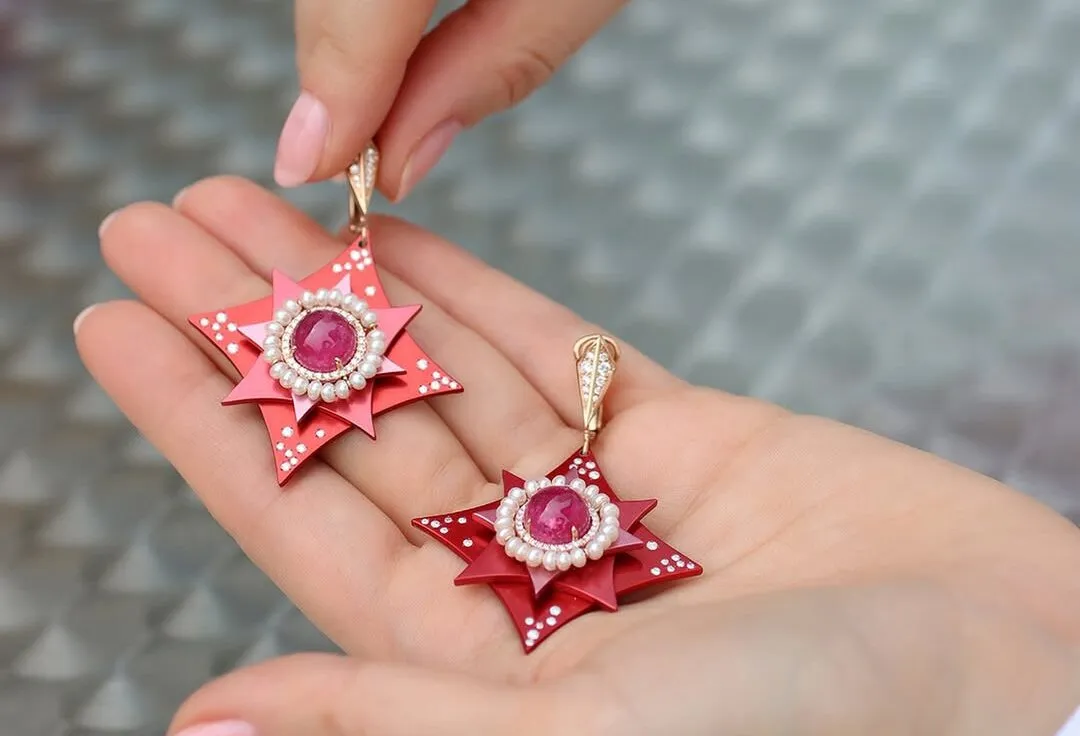 A closer look at the Mayiana MY Star earrings with two rubellite cabochons totalling 9.27 carats, 1.22 carats of diamonds and 6.16 carats of pearls set in 18k rose gold and pink and red aluminum 
