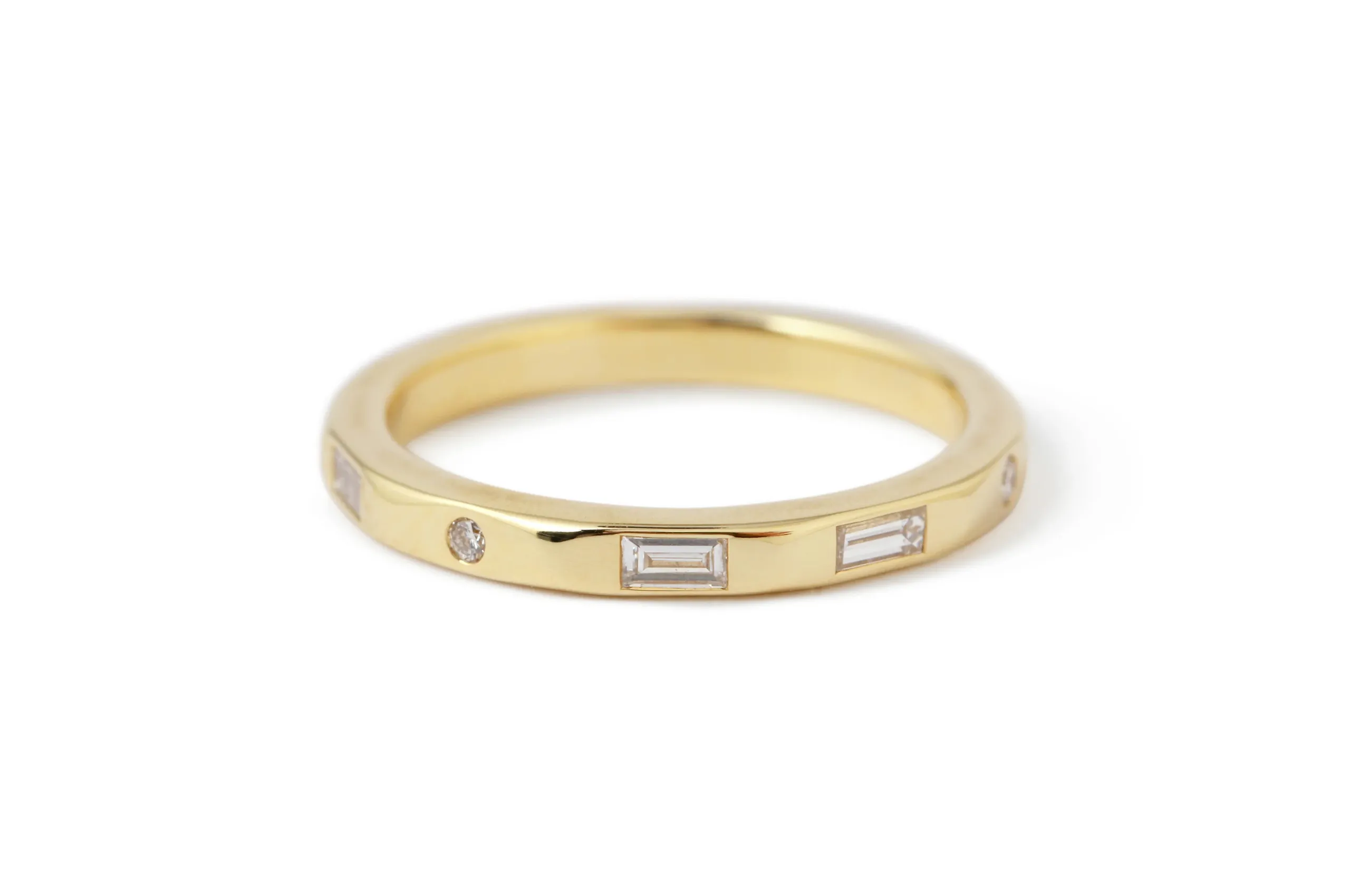 Send a secret message with Melissa Joy Manning's Morse Code I Love You diamond band in 18K yellow gold.