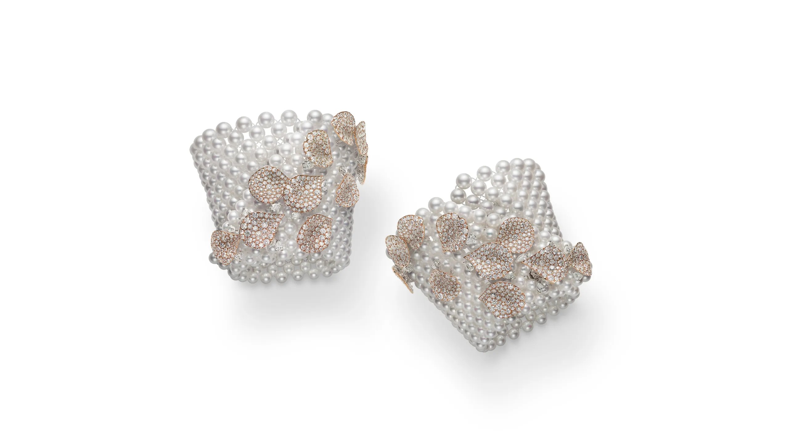 A pair of Akoya cultured pearl cuff bracelets with more than 45 carats of diamonds set in 18k rose gold, part of the Mikimoto Les Pétales High Jewellery collection