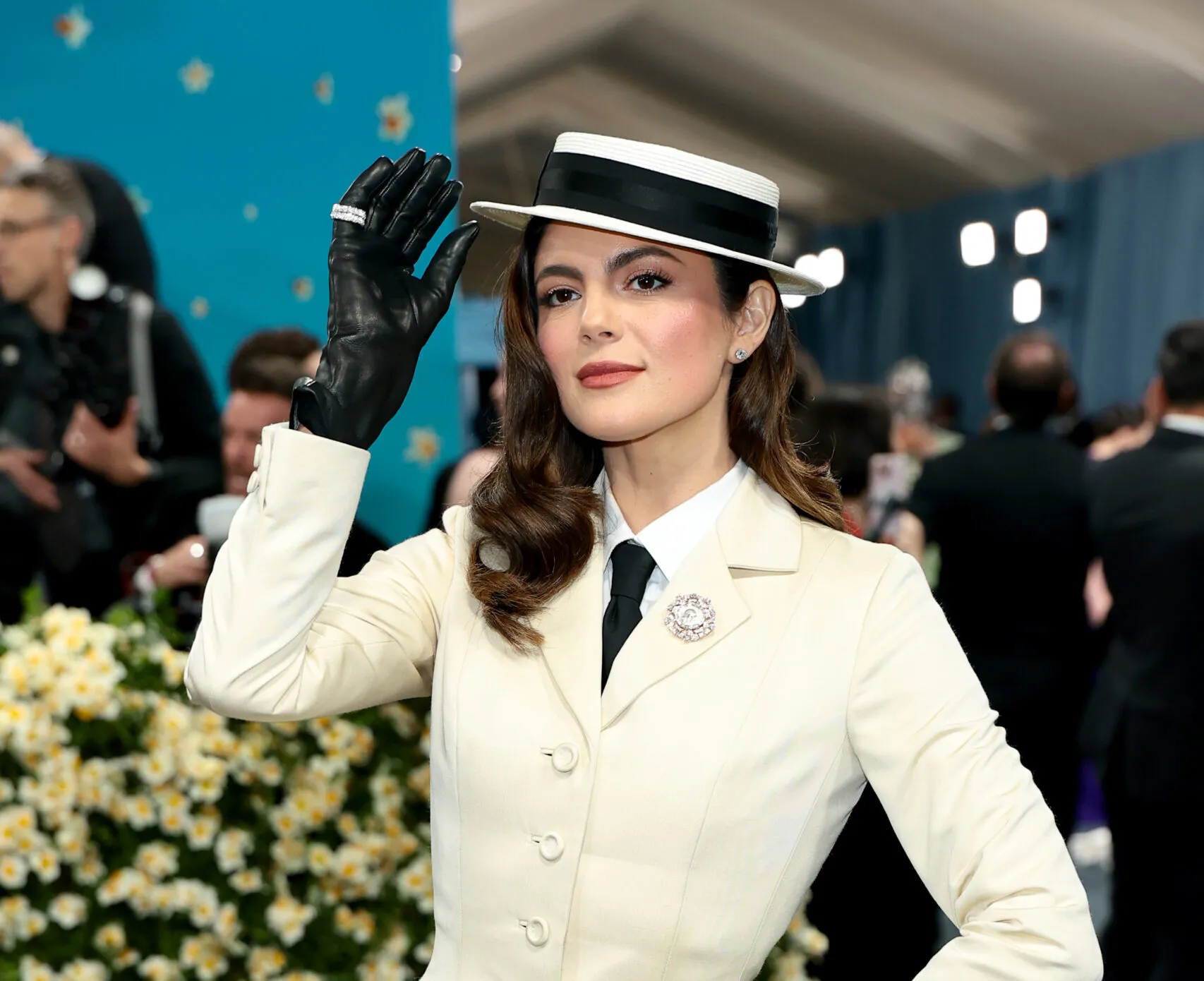 Actress Monica Barbaro pinned a Bvlgari Monete High Jewellery brooch to the lapel of her vintage Dior suit