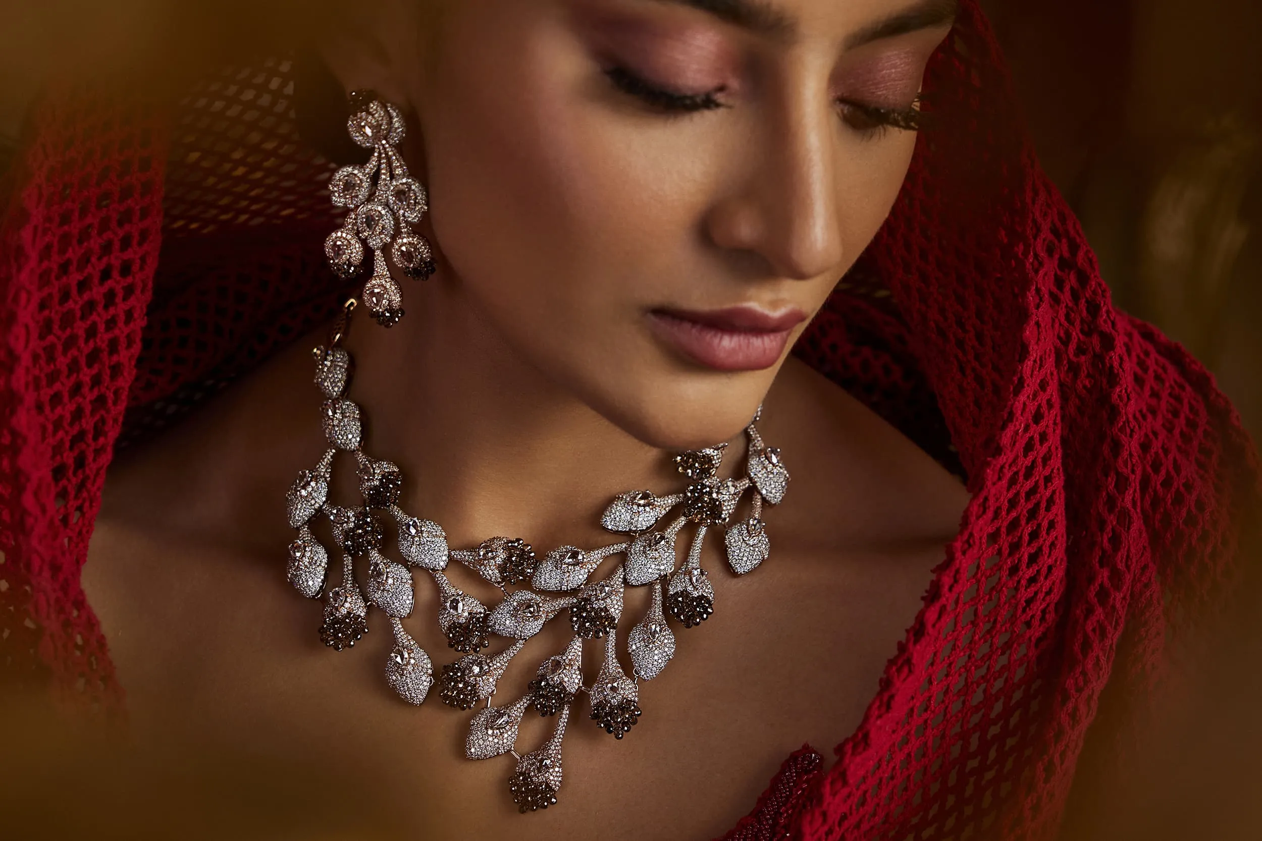<p>An exquisite Mrs. Marquise necklace and earrings, set with cascades of briolette cut brown diamonds alongside white diamonds</p>