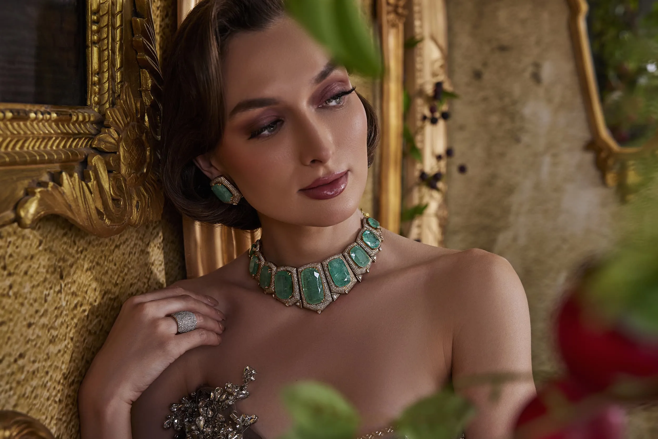 <p>Mrs. Marquise choker set with Russian emeralds clasped in shield-shaped pavé diamond mounts that recall the splendour of Hyderabad’s royal jewels</p>