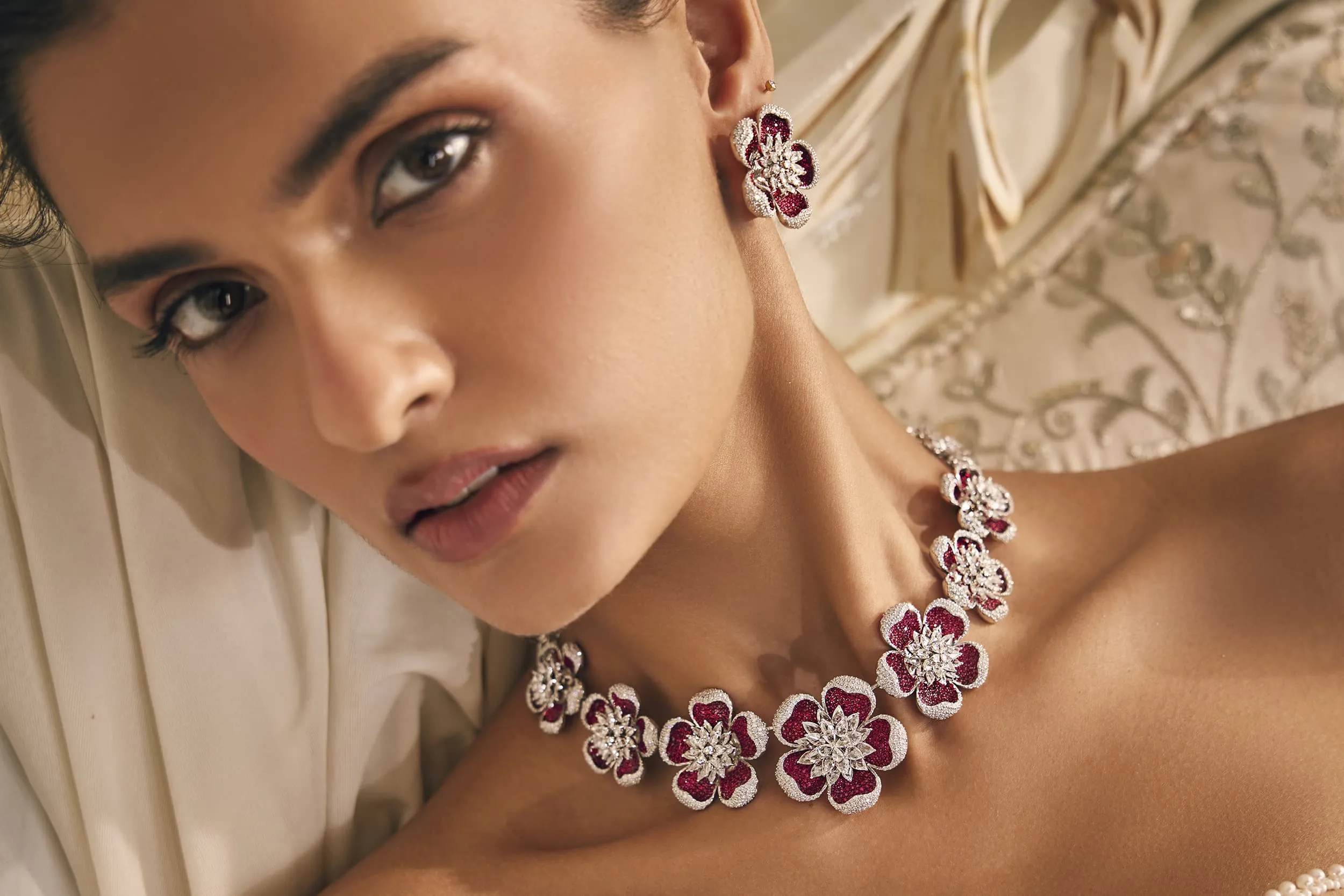 <p>Mrs. Marquise floral ruby and diamond necklace and earrings. Designed as sculptural flowers, soft shapes and rich tones come together in a piece that stands apart</p>
