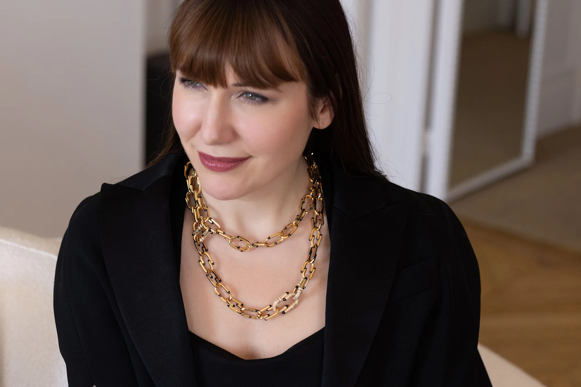 Katerina Perez wears the Nouvel Héritage Try Me High Jewellery necklace with diamonds and black ceramic accents in 18k yellow gold 