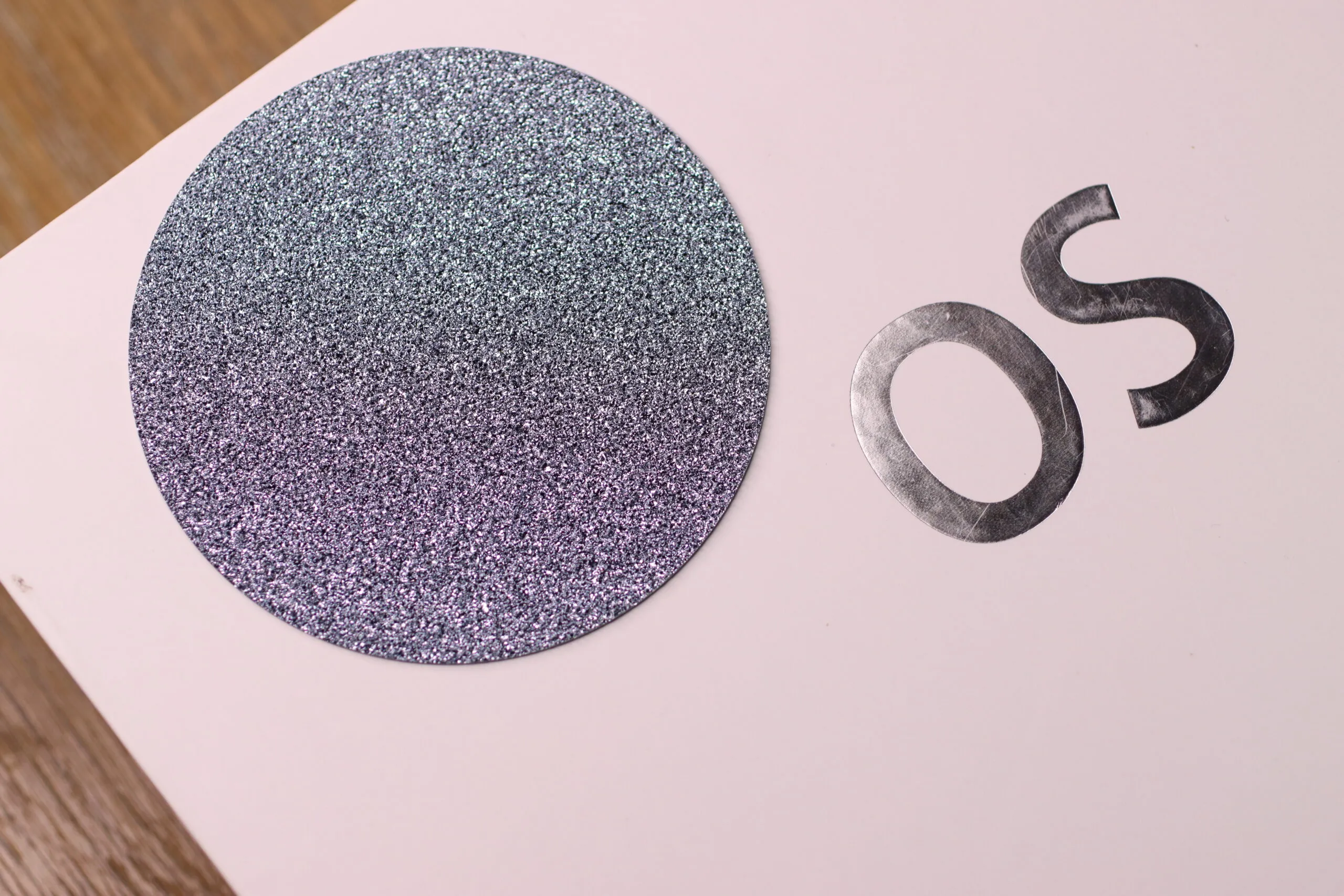 A large, flat disc of crystalline osmium that can be cut into shapes and set into fine and high jewellery creations