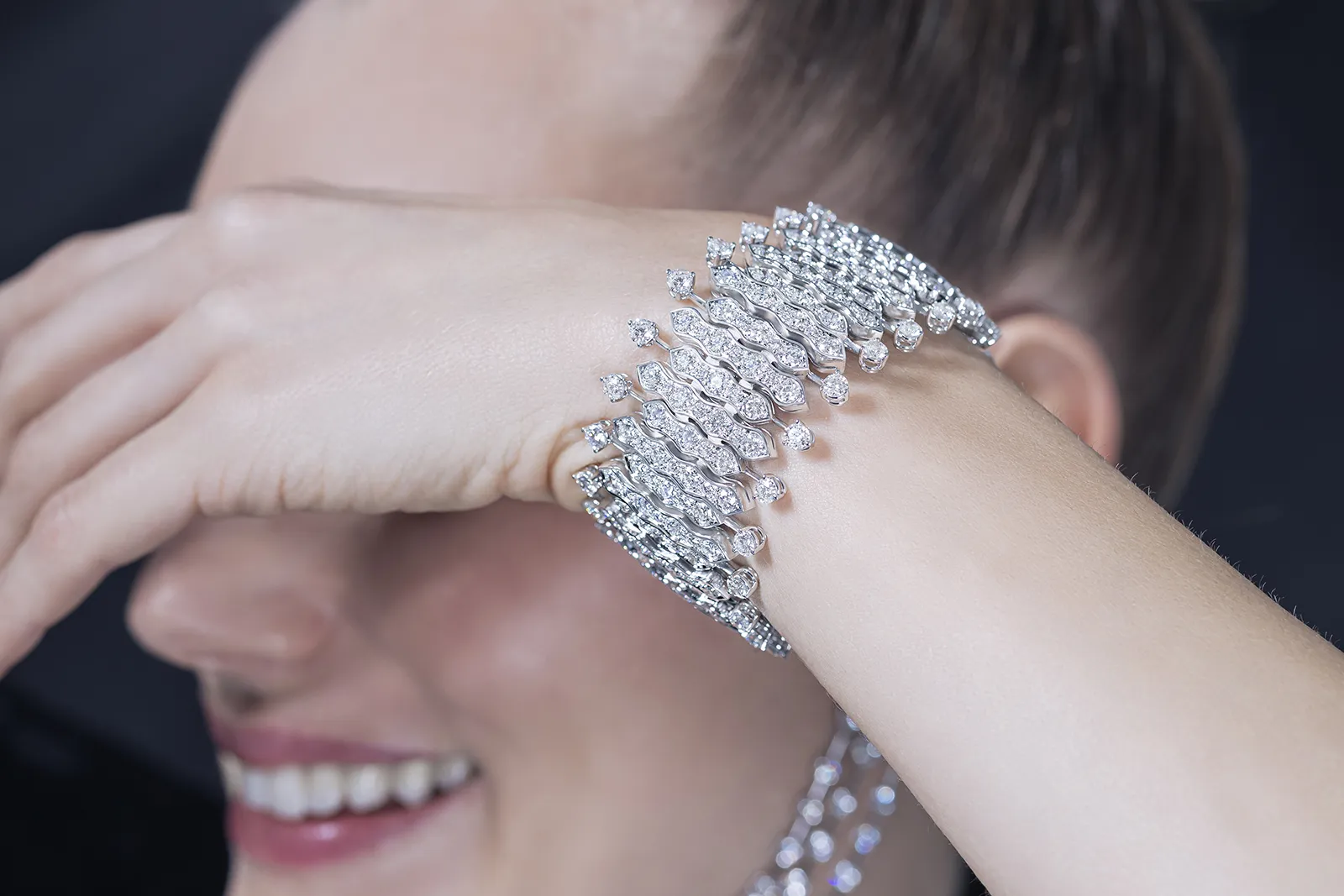 A model wears the Picchiotti Waves bracelet from the Picchiotti Classics collection with 30.76 carats of round brilliant-cut diamonds set in 18k white gold 