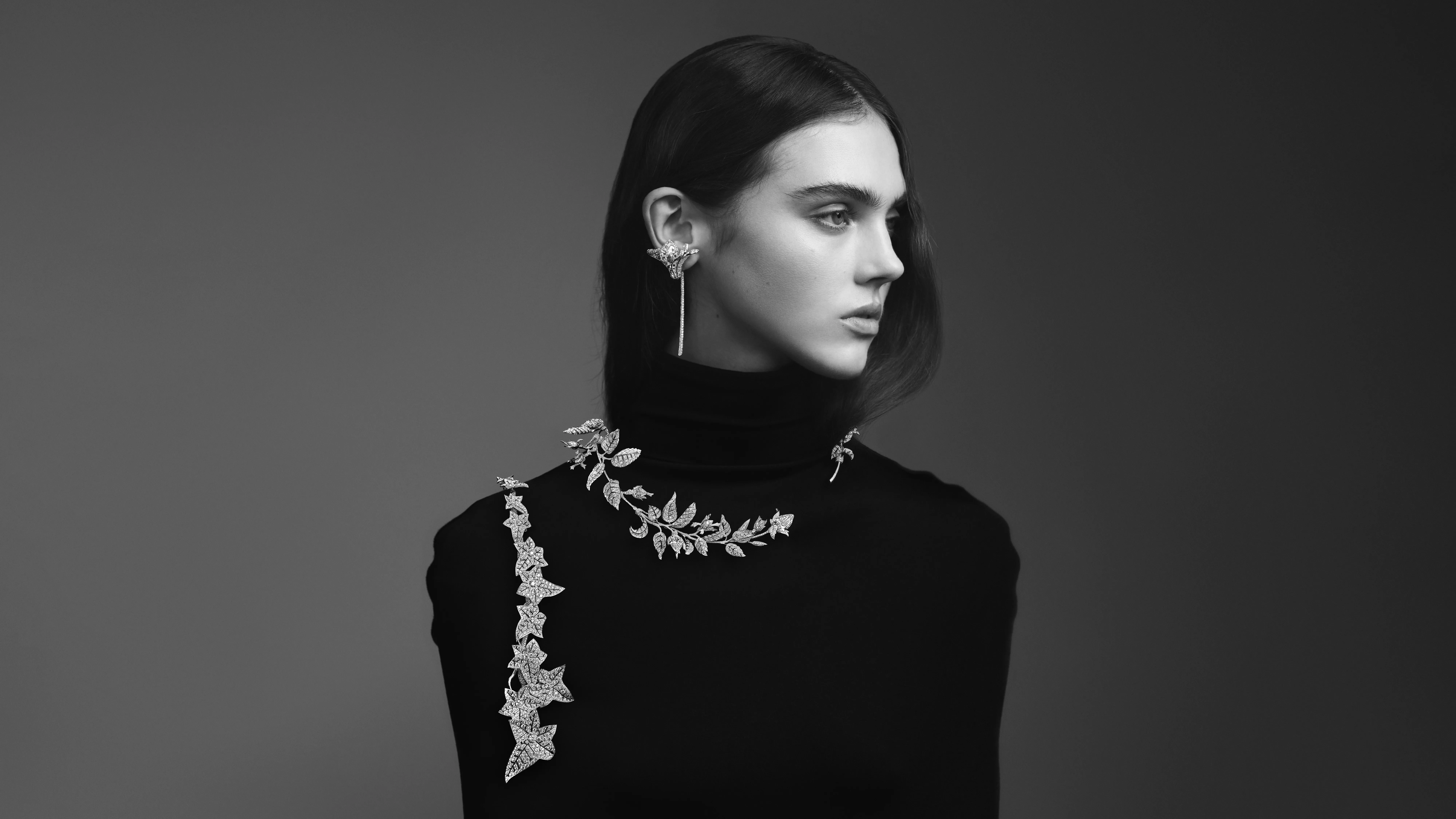A model wears the Boucheron Rosier necklace set with three pear-cut type IIA diamonds of 8.15 carats, 4.19 carats, and 2.01 carats, plus further diamonds in 18k white gold, part of the Untamed Nature Histoire de Style 2025 High Jewellery collection 