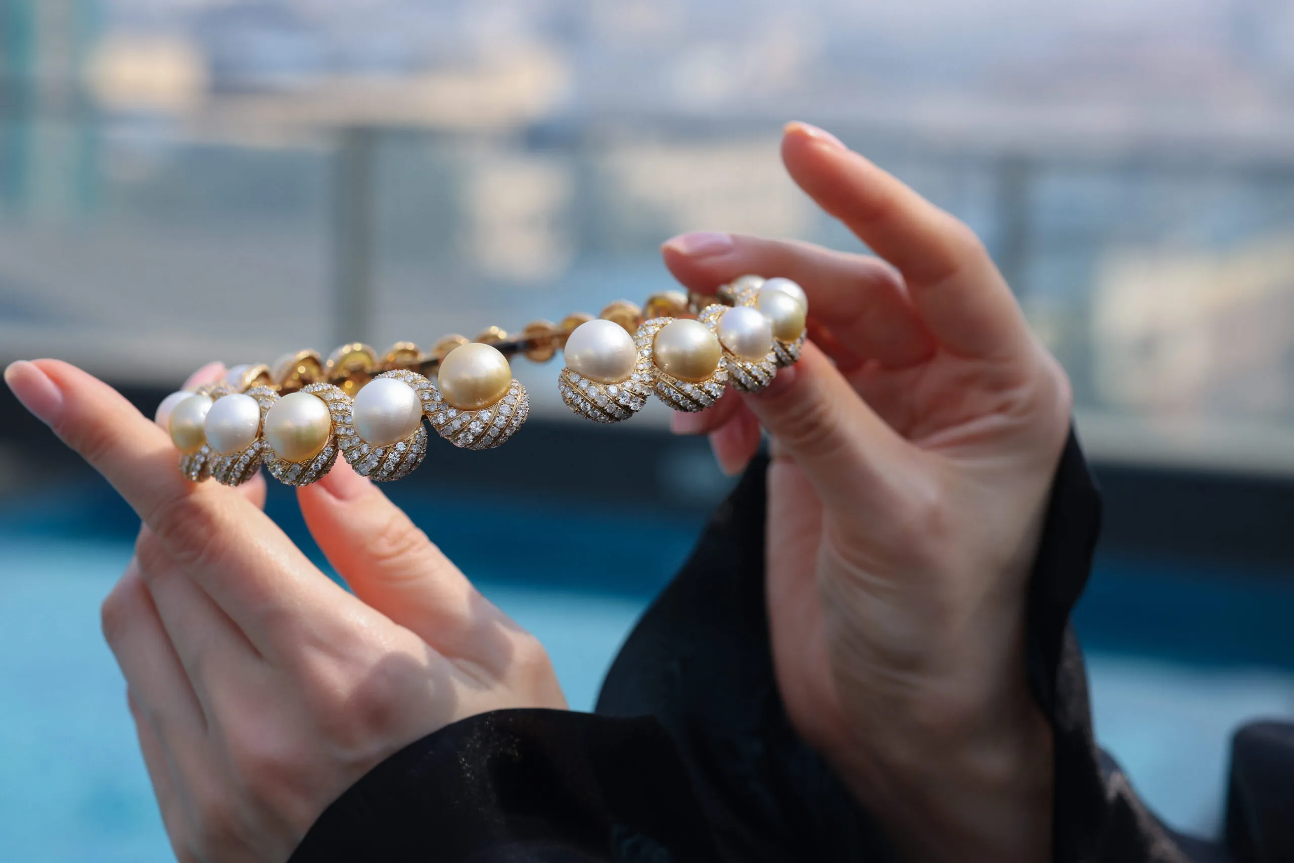 <p>The Luminous Twin collar necklace by Renu Oberoi with 18.5 carats of diamond swirls surrounding 167.3 carats of golden and white pearls</p>