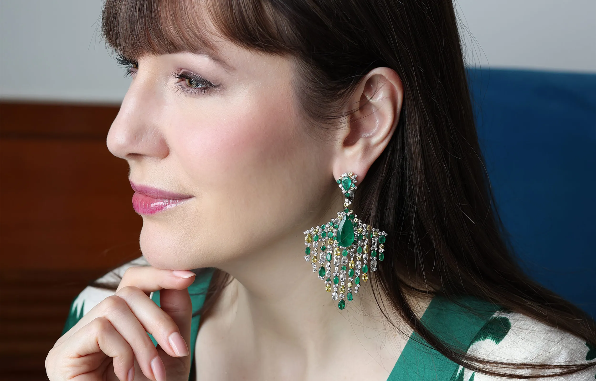 <p>Katerina Perez wears the Emerald Cascade earrings by Renu Oberoi with 9.15 carats of diamonds and pear-shaped emeralds and yellow sapphires totalling 39.62 carats</p>