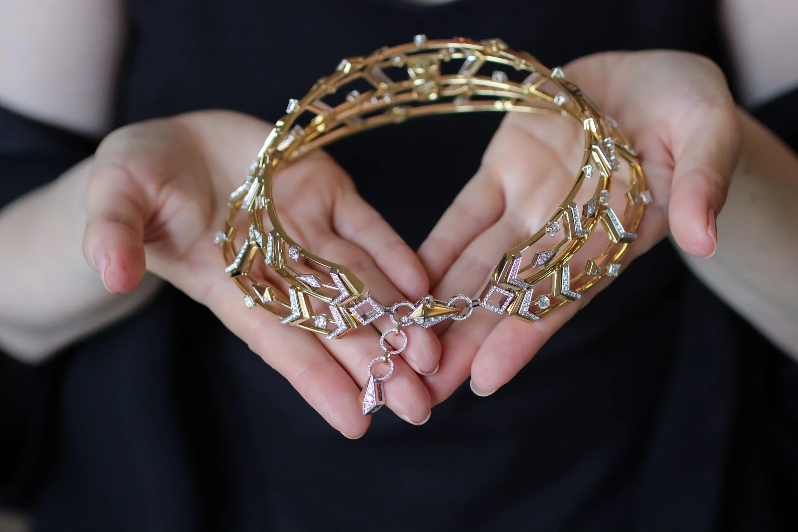 The decorative clasp of the Sahag Arslanian High Jewellery choker from the Celestial Radiance collection with a 10.26-carat cushion-cut fancy deep brownish yellow VS2 diamond, 5.04 carats of princess-cut white diamonds, 5.49 carats of round white diamonds, and 4.83 carats of round white melee, set in 18k white and yellow gold