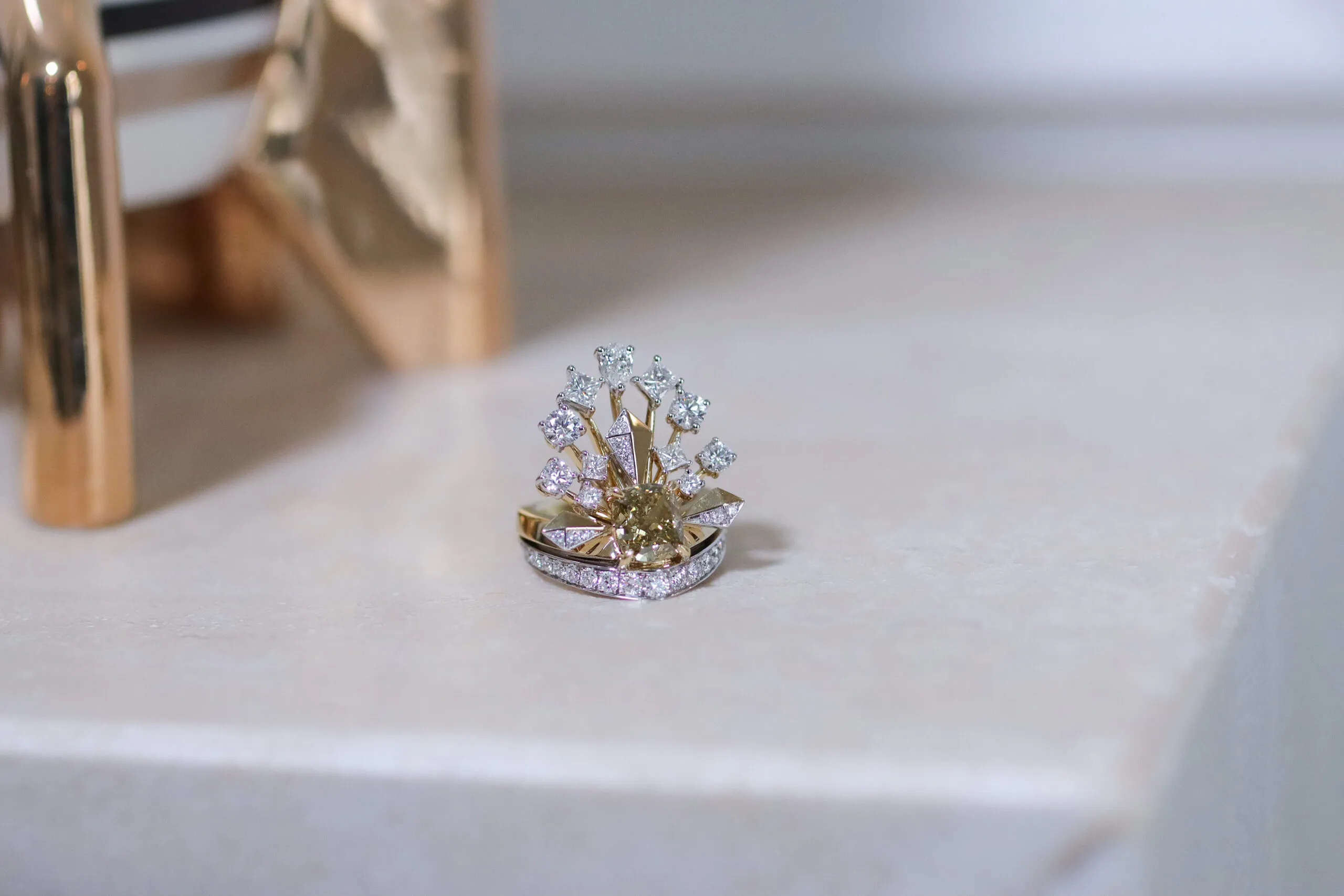 Sahag Arslanian Celestial Radiance High Jewellery ring with a 2.44-carat cushion-cut fancy dark brown-yellow diamond surrounded by further pear-shaped, princess-cut and round brilliant-cut white diamonds set in 18k white and yellow gold  