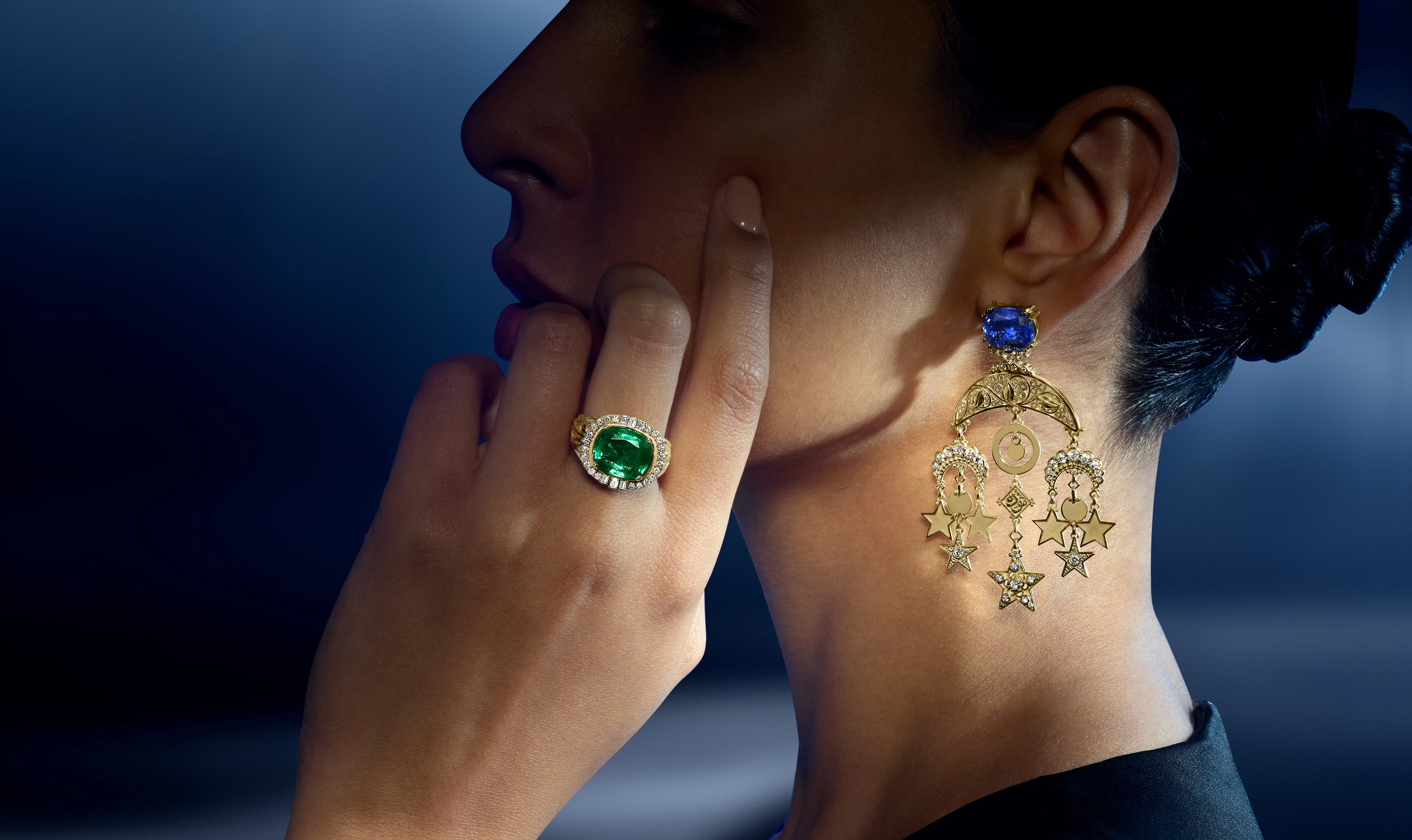 A model wears pieces from the Azza Fahmy Tales of the Nile High Jewellery collection, including the Scripts of Love bangle, the Crescent Filigree earrings, and the Echoes of Nature ring 