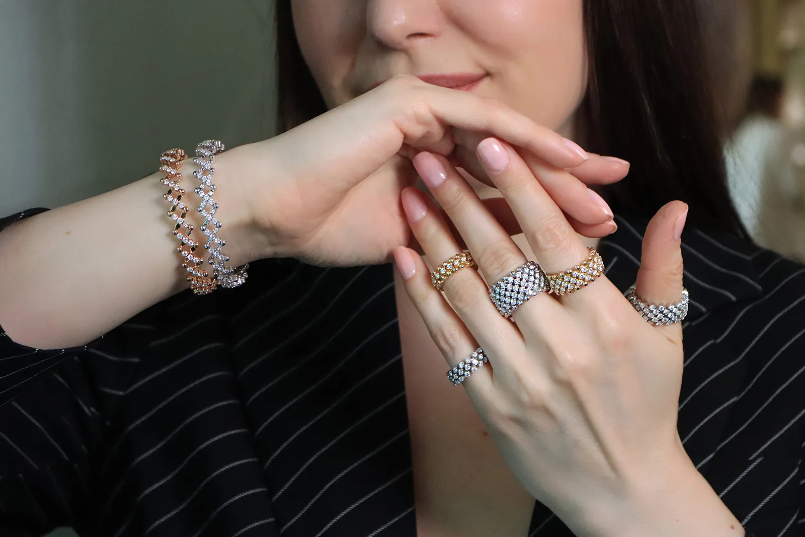 Katerina Perez wears multi-sized rings and expanding ring-to-bracelet jewels by Serafino Consoli