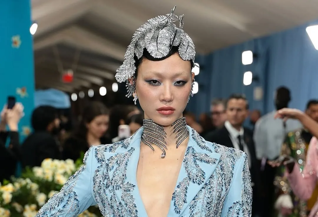 Model Sora Choi's artistic headdress, earrings, necklace and rings were dripping in diamonds