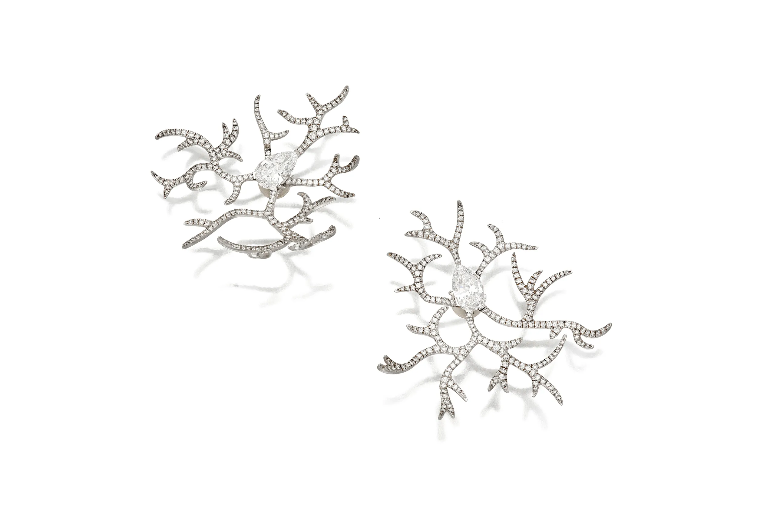 <p>JAR diamond earclips featuring pear-shaped diamonds with radiating branches set with round diamonds</p>
