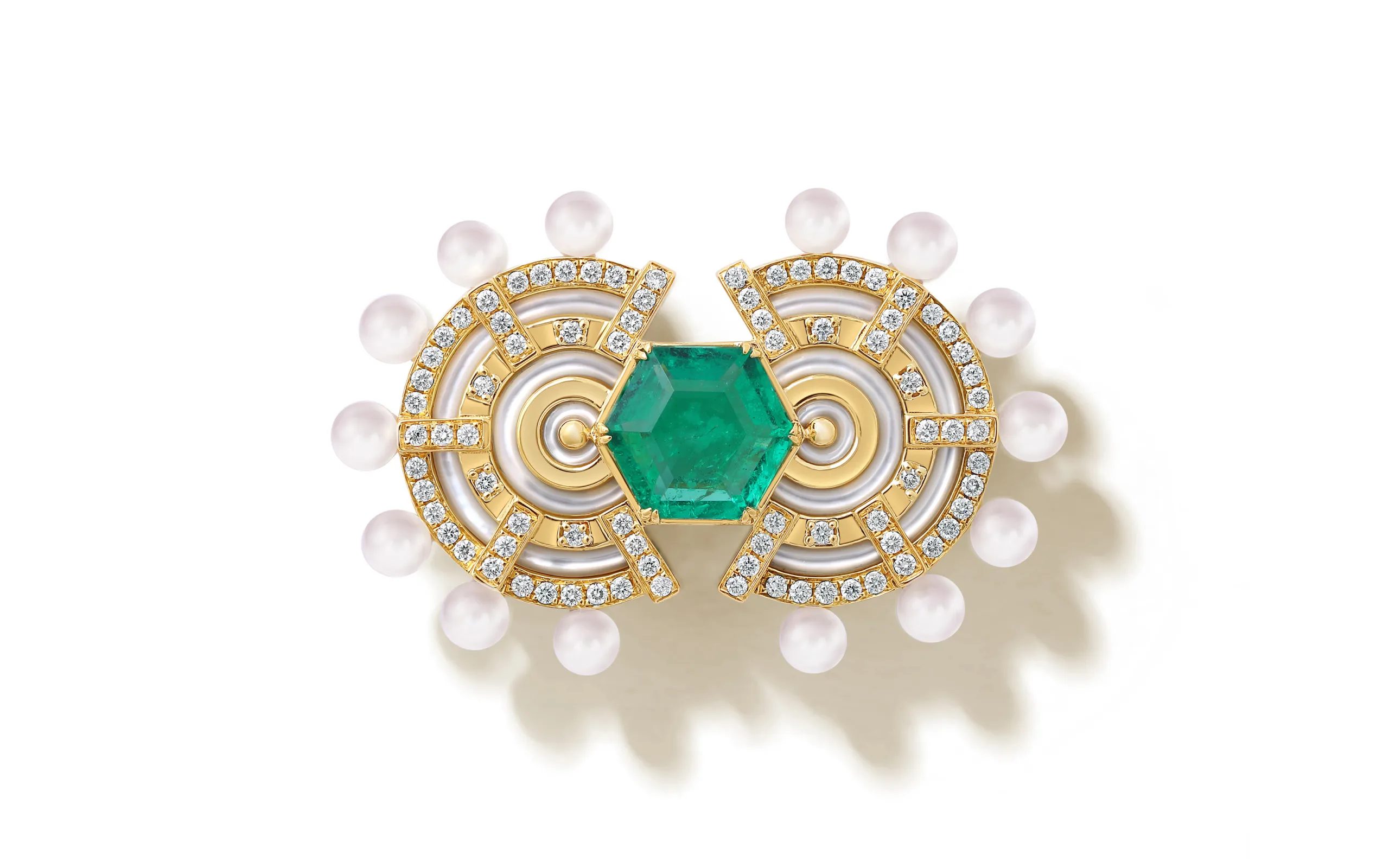 The State Property Raisina Snowdrop brooch draws inspiration from the Art Deco period as well as the Amrit Udyan gardens in India, featuring emeralds, diamonds, Akoya pearls, and mother of pearl in 18k gold