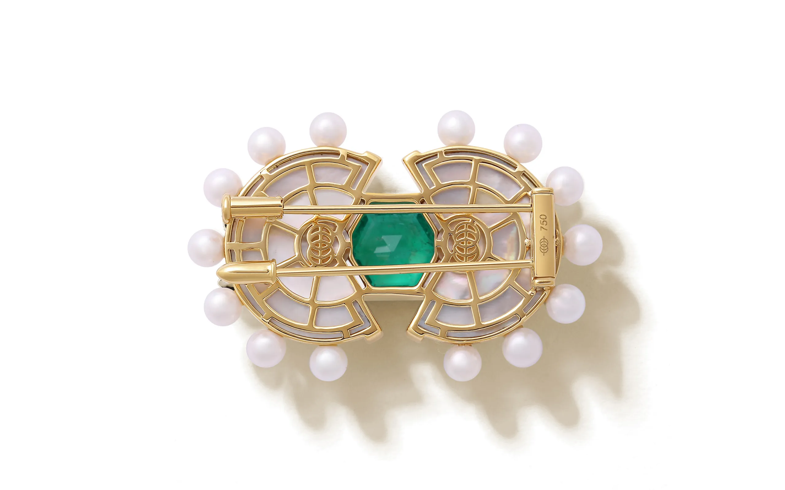 The reverse side of the State Property Raisina Snowdrop brooch with emeralds, diamonds, Akoya pearls, and mother of pearl in 18k gold