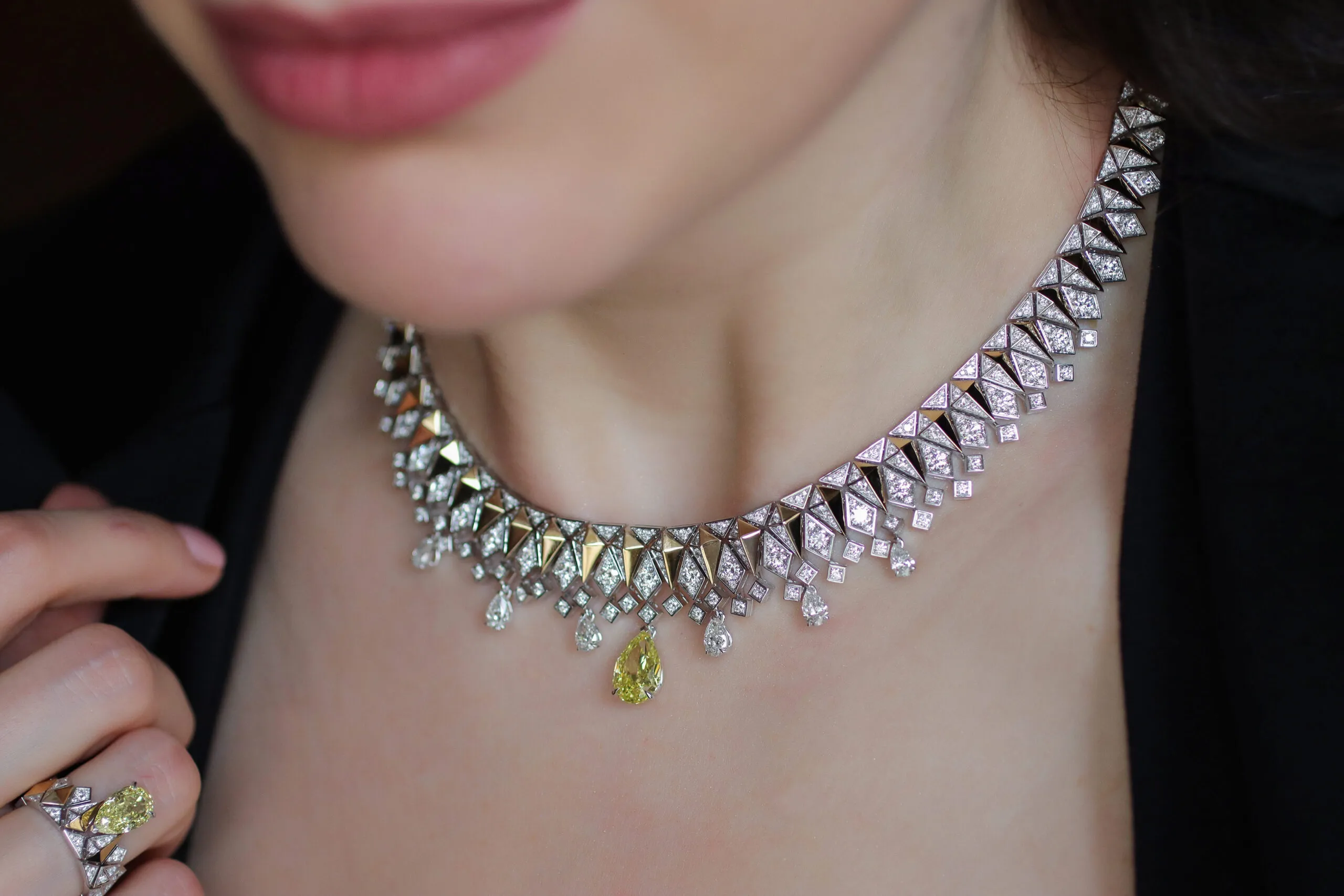 Katerina Perez wears the Sahag Arslanian Sun Rays High Jewellery collier with a 3.14-carat pear-shaped fancy intense yellow SI1 diamond, surrounded by pear-shaped white diamonds and 10.44 carats of round white diamonds set in 18k gold 