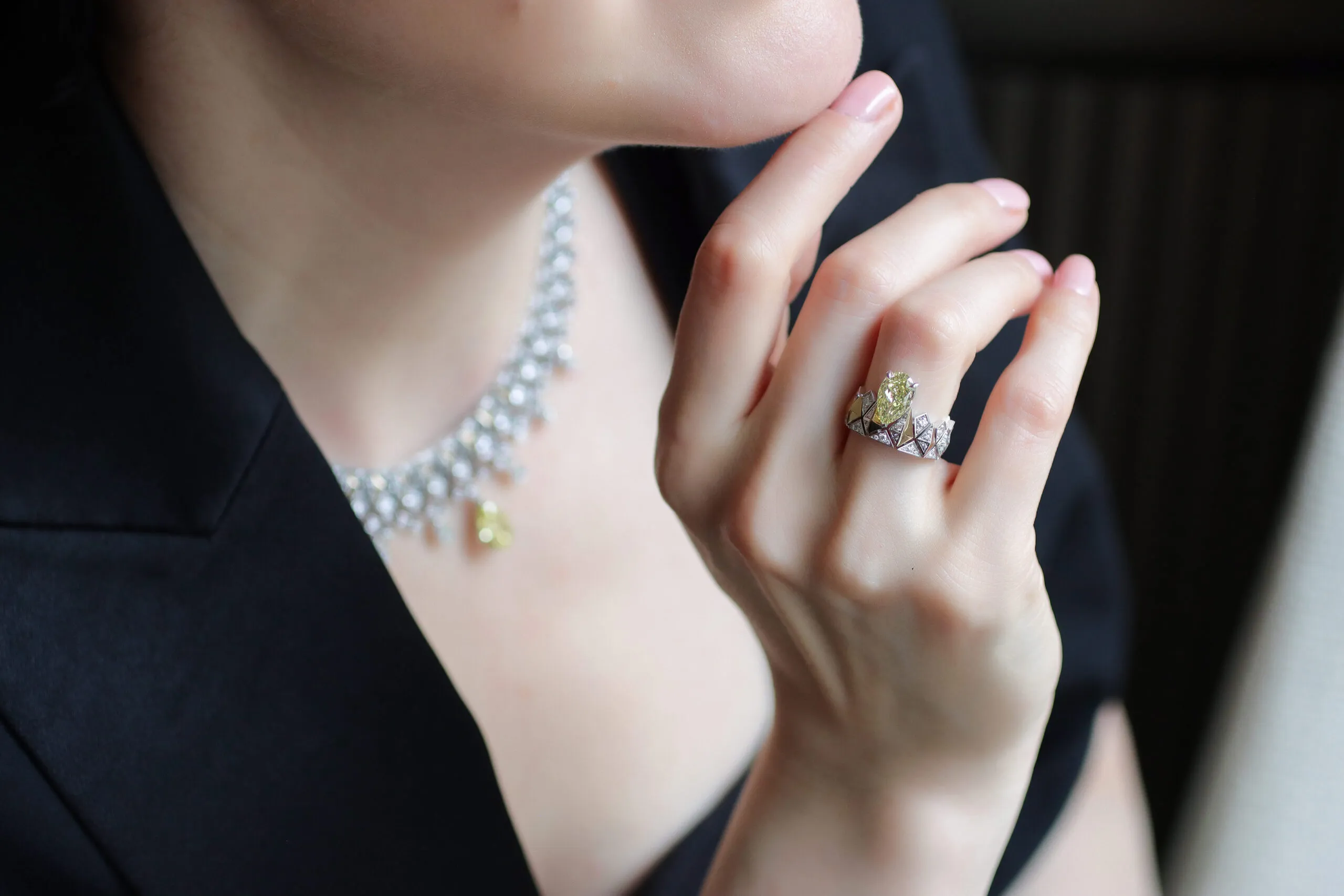 Katerina Perez wears the Sahag Arslanian Sun Rays ring with a 2.38-carat pear-shaped fancy intense yellow VS2 diamond, surrounded by 0.64 carats of white diamonds and set in 18k gold, alongside the matching necklace 