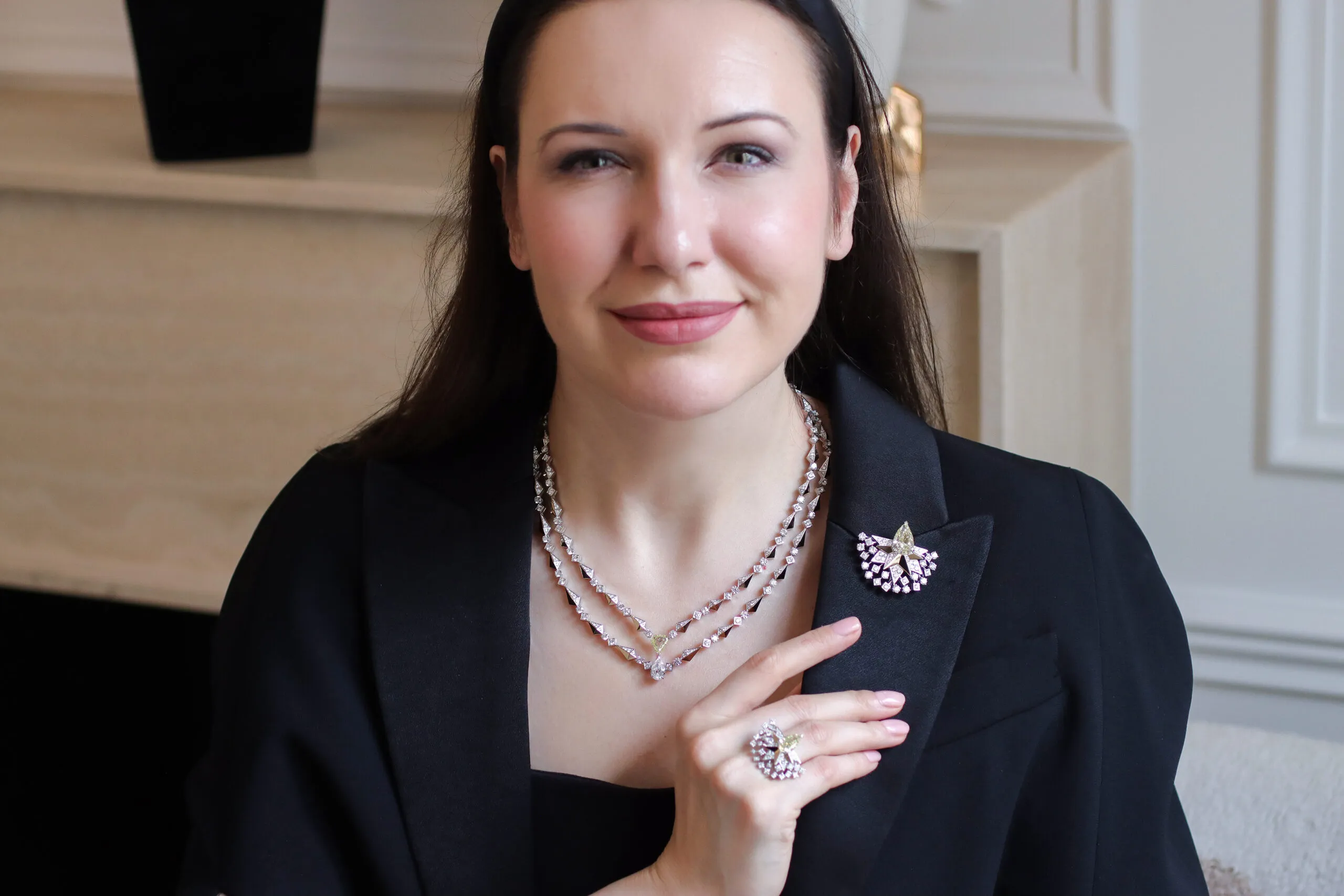 Katerina Perez wears the Sahag Arslanian Sun Rays High Jewellery necklace with the 8.88-carat pear-shaped fancy yellow VS2 diamond in the central motif worn as a brooch, alongside the matching Sun Rays High Jewellery ring with a 3.38-carat pear-shaped fancy yellow VS2 diamond and round white diamonds, all crafted in 18k white and yellow gold  
