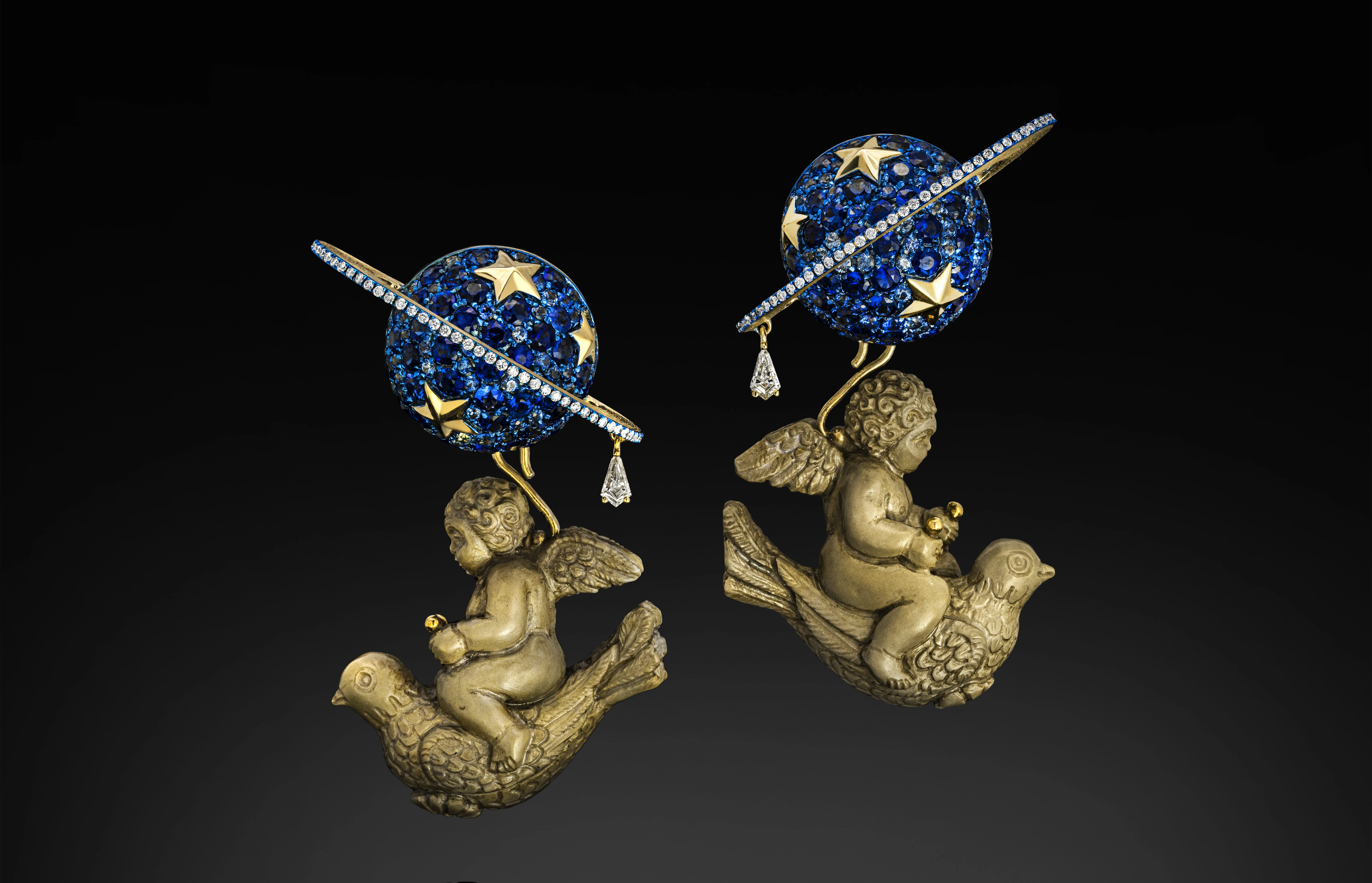 Austy Lee The Cupids Travel to Jupiter earrings from The Ancient Fetus Collection with antique lava cameo, blue sapphires, and diamonds