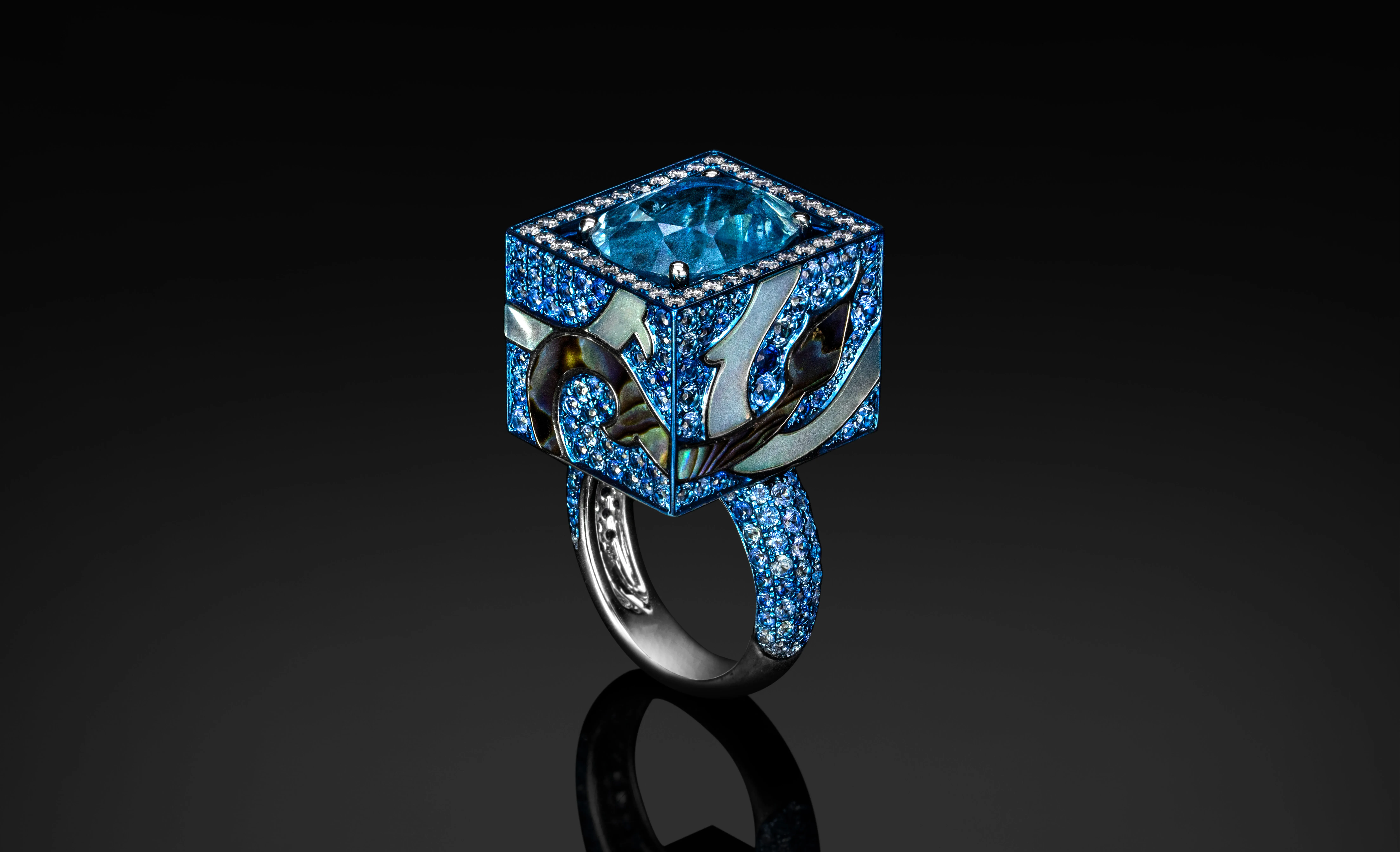 Austy Lee The Legend of White & Green Snake ring from The Sanctus-cubus Collection with Santa Maria aquamarine, mother of pearl, abalone shell, blue sapphires, and diamonds