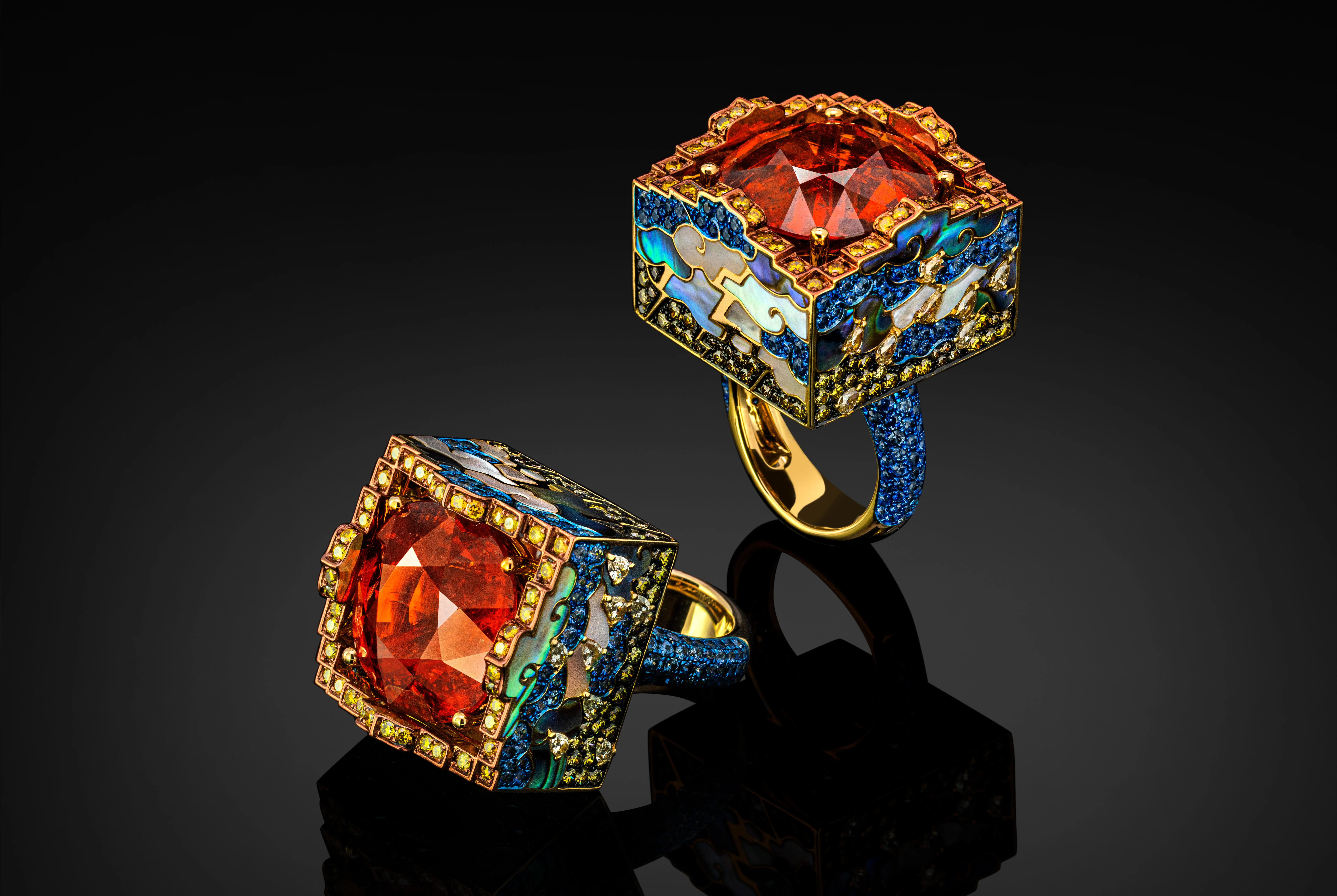 Austy Lee The Parisan Poet Thunder & Rain ring from The Sanctus-cubus Collection with spessartite garnet, diamonds, blue sapphire, abalone shell and mother of pearl