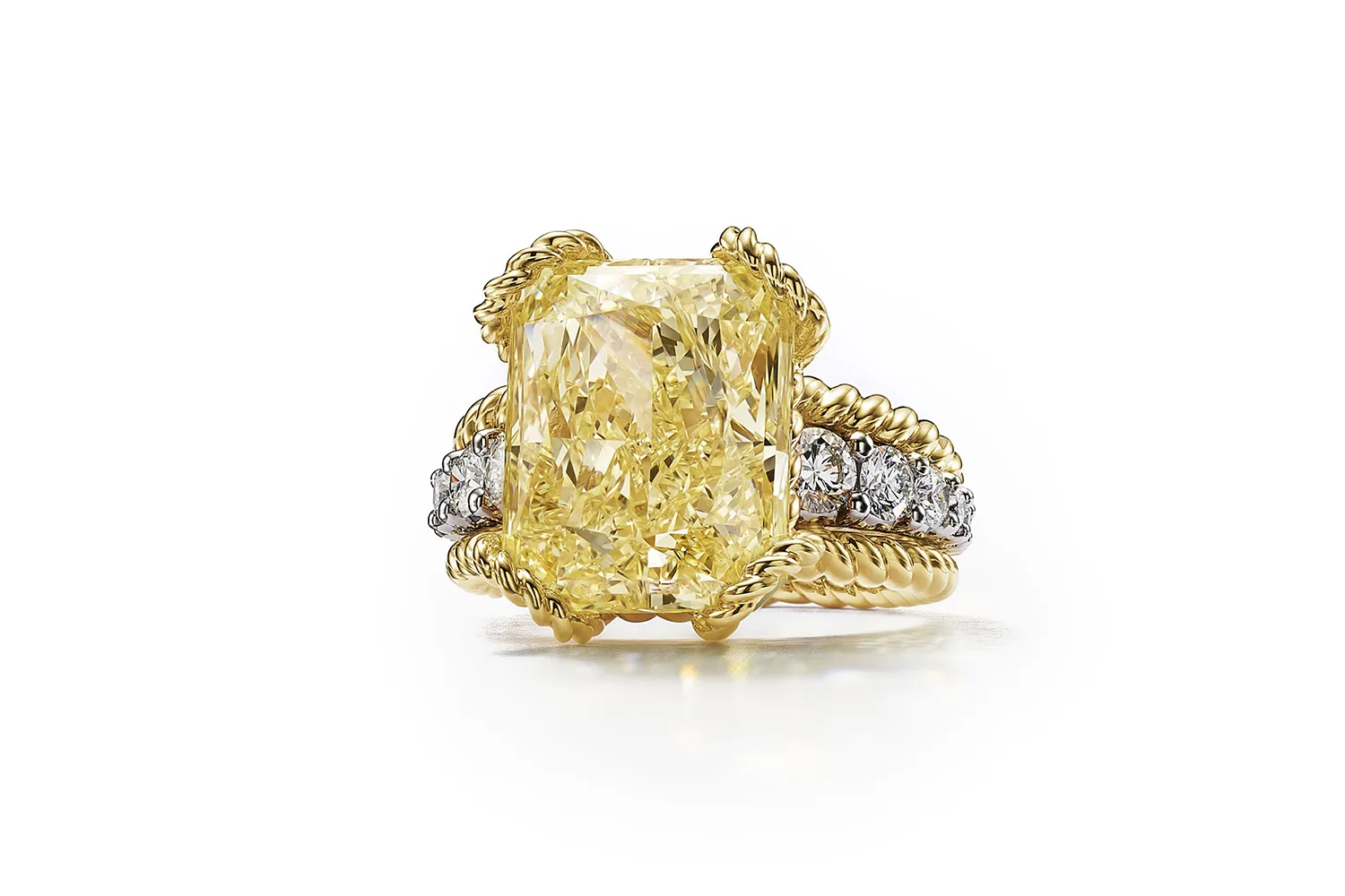 Tiffany & Co. Urchin ring with a fancy intense yellow diamond weighing over 12 carats set in 18k yellow gold and platinum, surrounded by white diamonds, from the Sea of Wonder Blue Book 2025 High Jewellery collection 