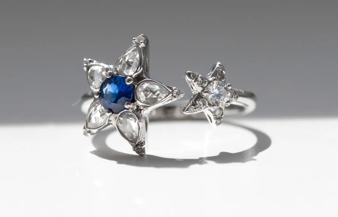 Valentina Fine Jewellery Star Open ring with 1.13 carats of rose- and brilliant-cut diamonds and a 0.36-carat Ceylon sapphire set in 18k white gold
