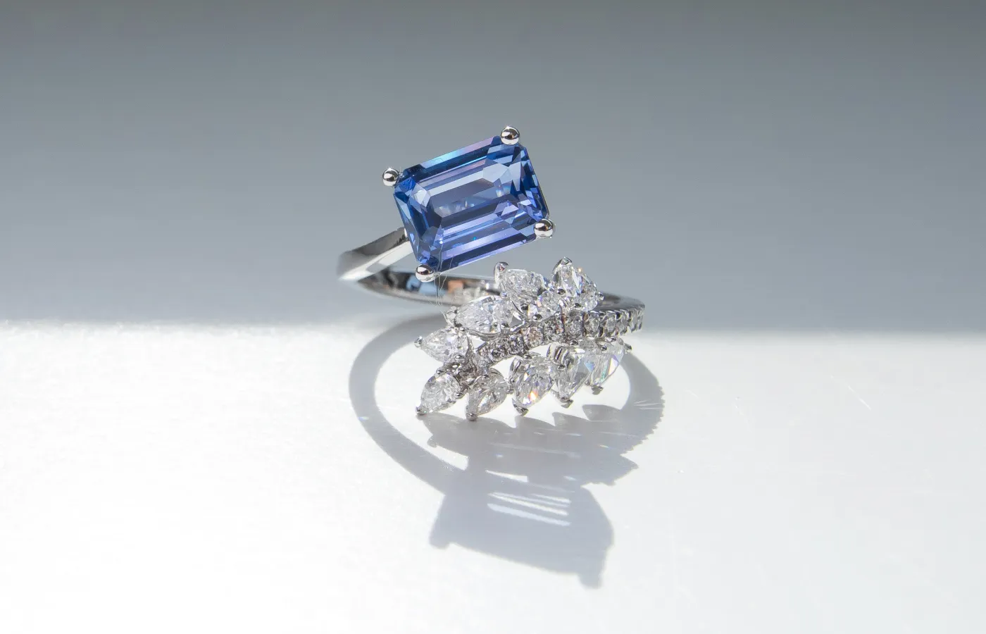 Valentina Fine Jewellery Leaf ring with a 2.50-carat emerald-cut unheated Ceylon sapphire and 0.82 carats of pear-shaped and round brilliant-cut diamonds in platinum
