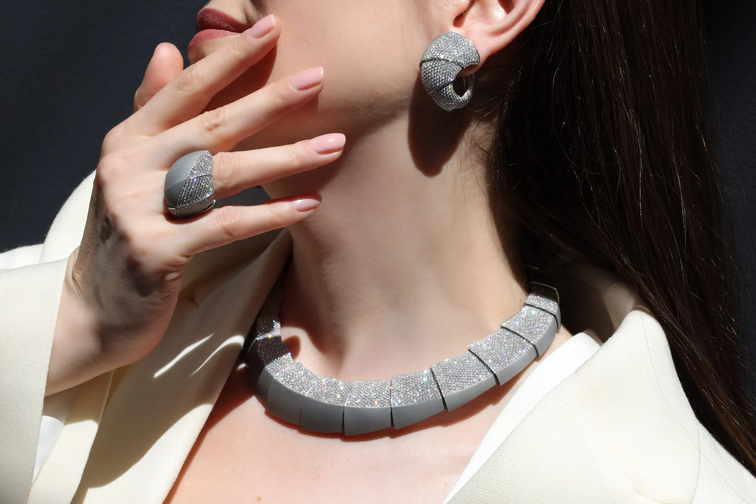 Katerina Perez wears the Vhernier Profilo Del Vento necklace, ring and ear clips from the Ardis High Jewellery collection, set with diamonds in matte 18k white gold